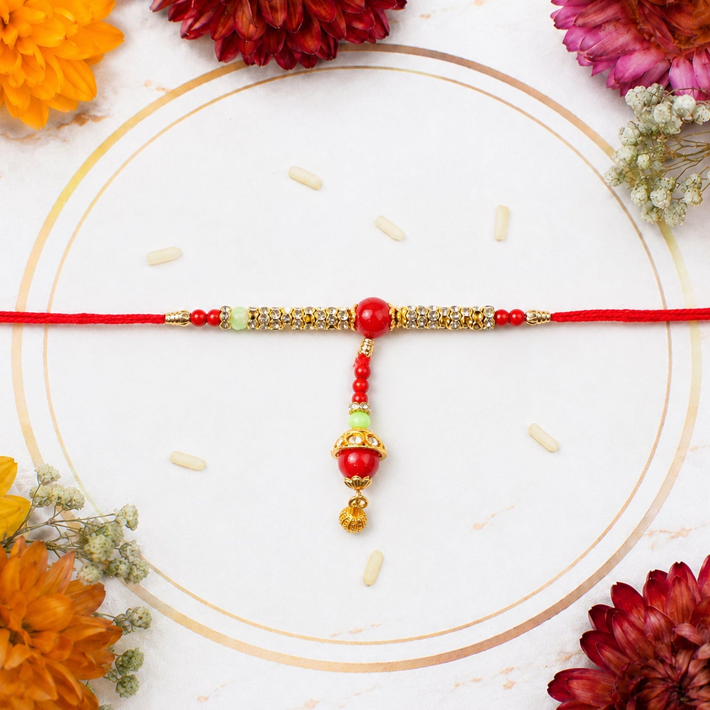 Side angle of Red Pearl Bhabhi Rakhi showcasing charm
