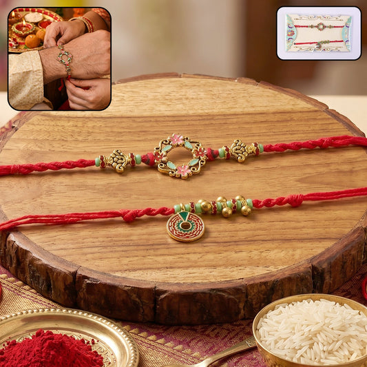 Floral Stone Bhabhi Rakhi with a pearl hanging on white background