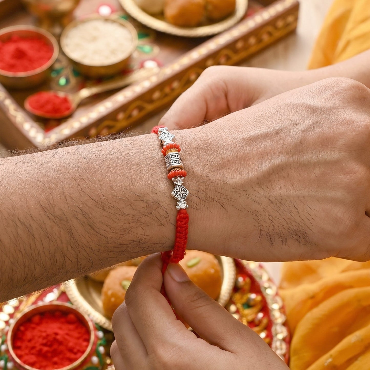 Leaf Charm detail on Bhabhi Rakhi with vibrant beads