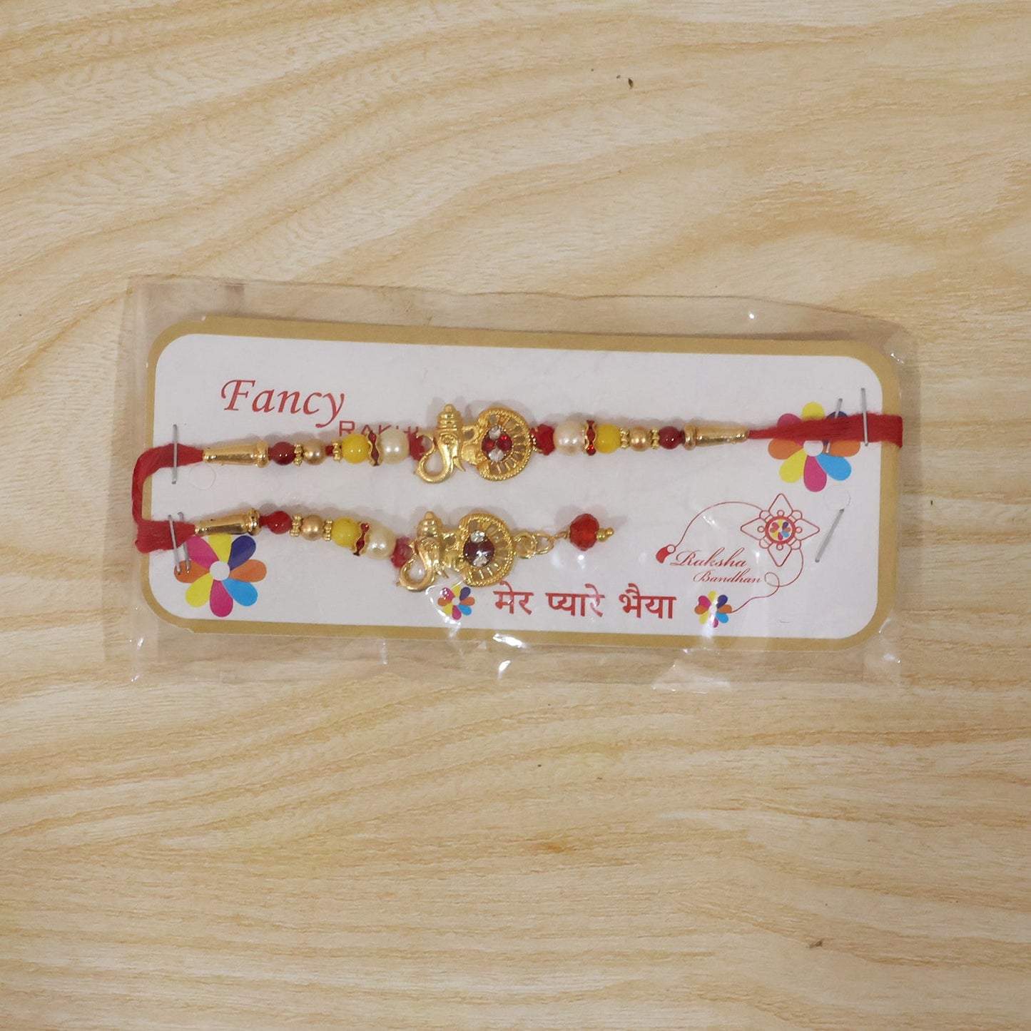 Complete view of golden ganesha bhabhi rakhi with pearl beads