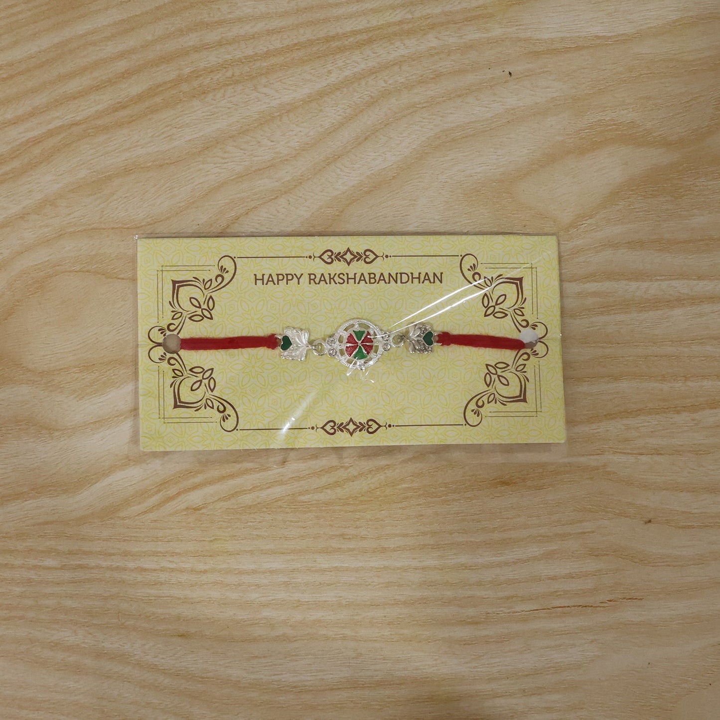 Silver Floral Design Rakhi with Red Thread (1 Pc)