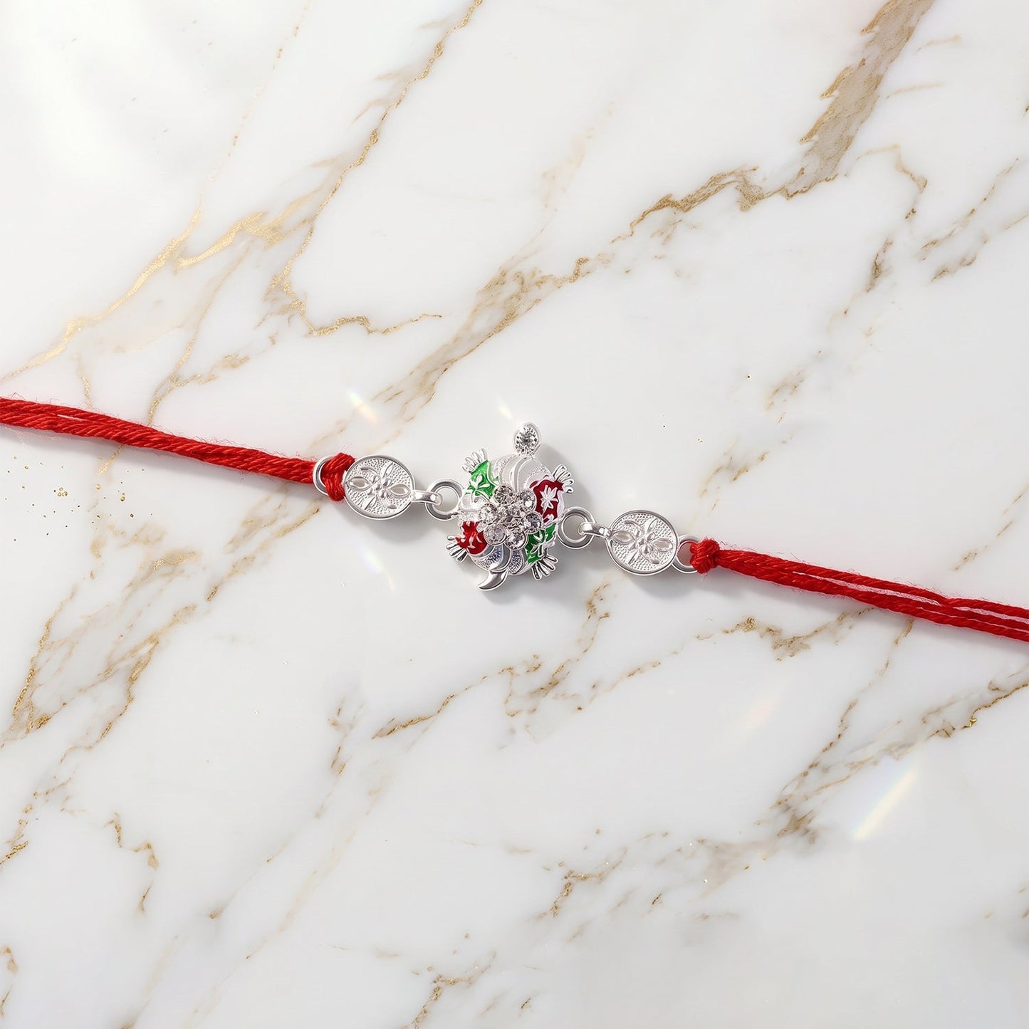 Detailed close-up of enamel floral design on rakhi