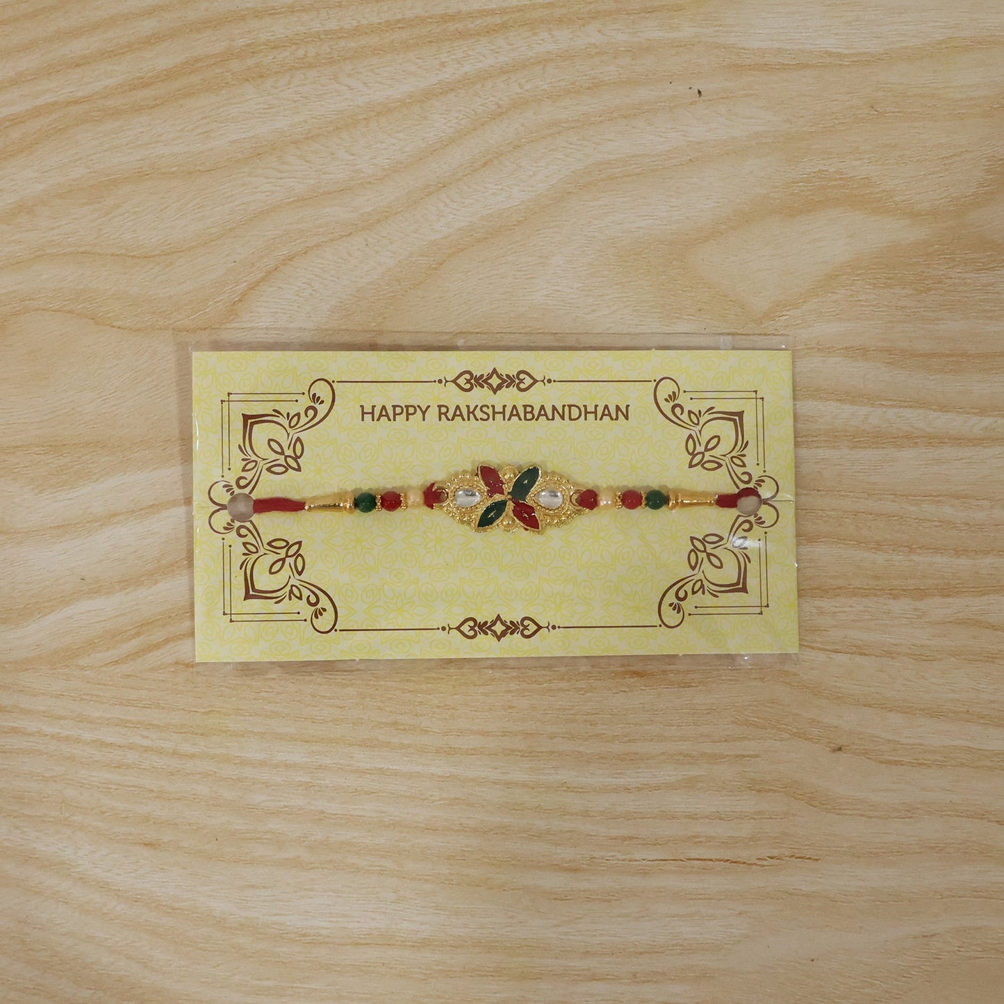 Front view of Floral Leaf Rakhi with beads