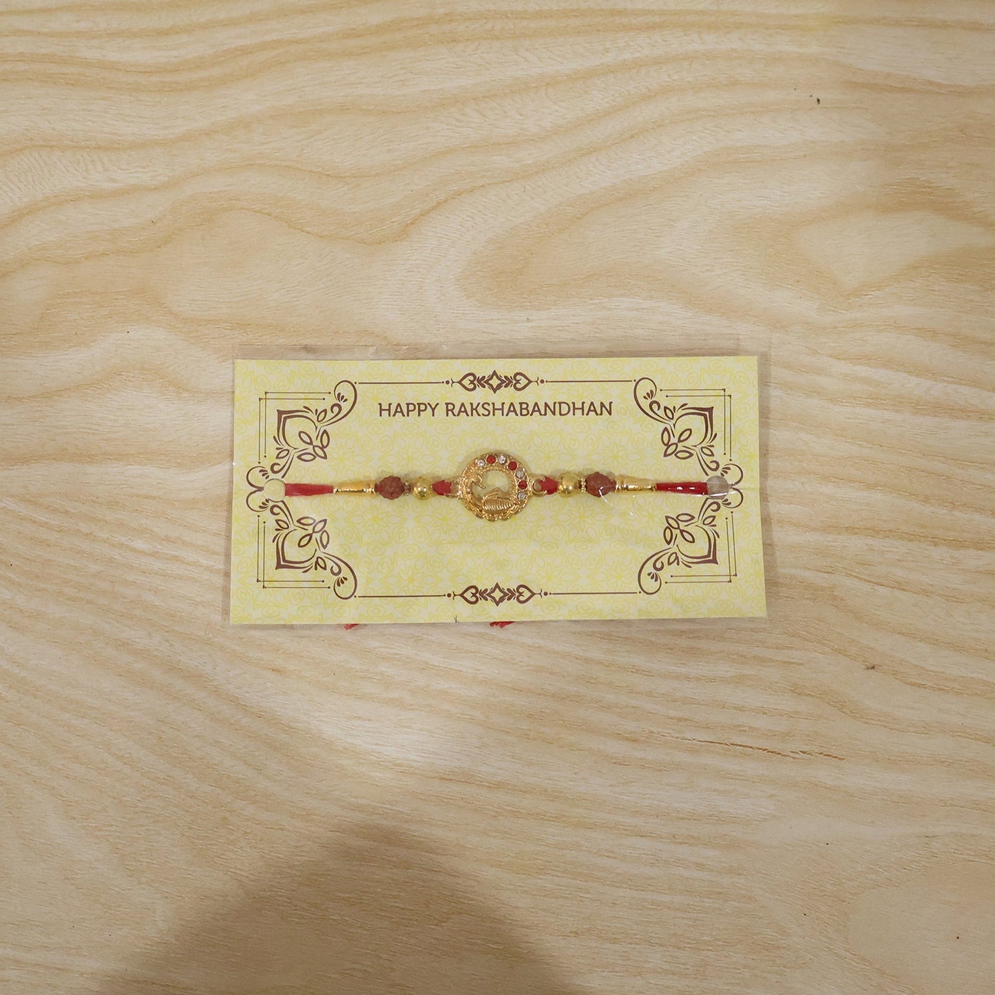 Golden Peacock design Rakhi arranged for Raksha Bandhan celebration