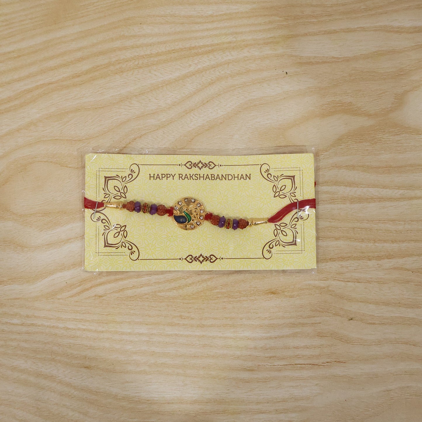 Complete Peacock Design Rakhi with decorative elements