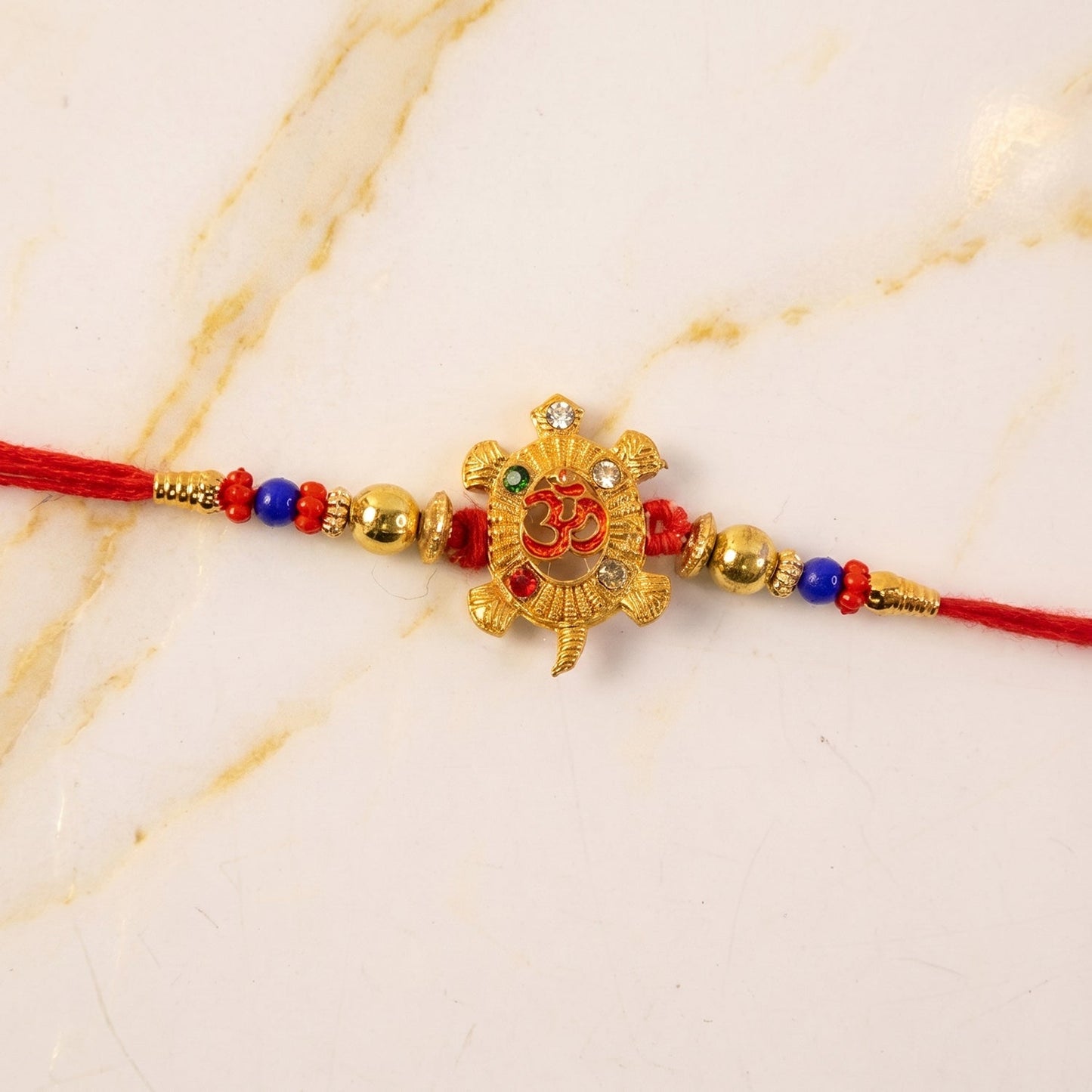 Om Turtle Design Rakhi with Colorful Beads (1 Pc)
