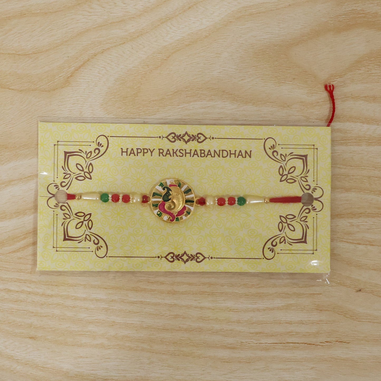 Top view of decorative Ganesh Rakhi highlighting beadwork