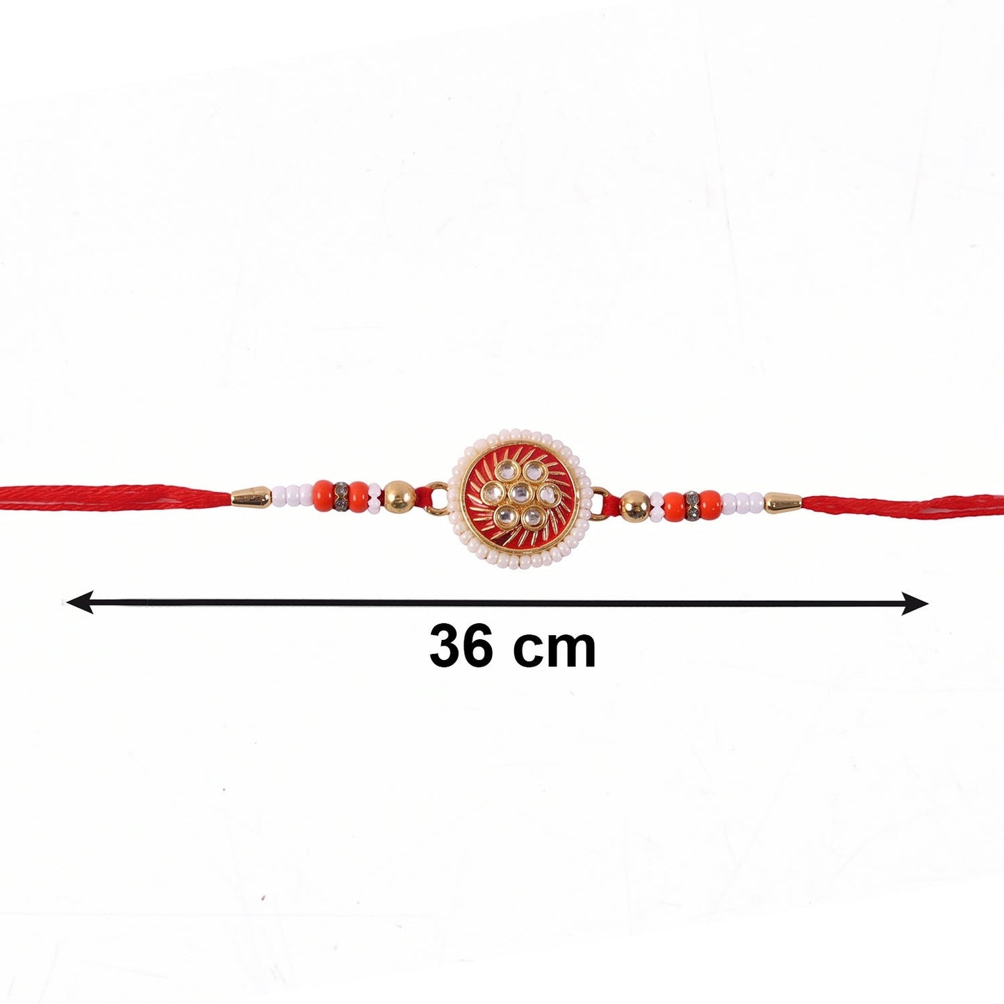 Golden floral rakhi displayed with soft thread details