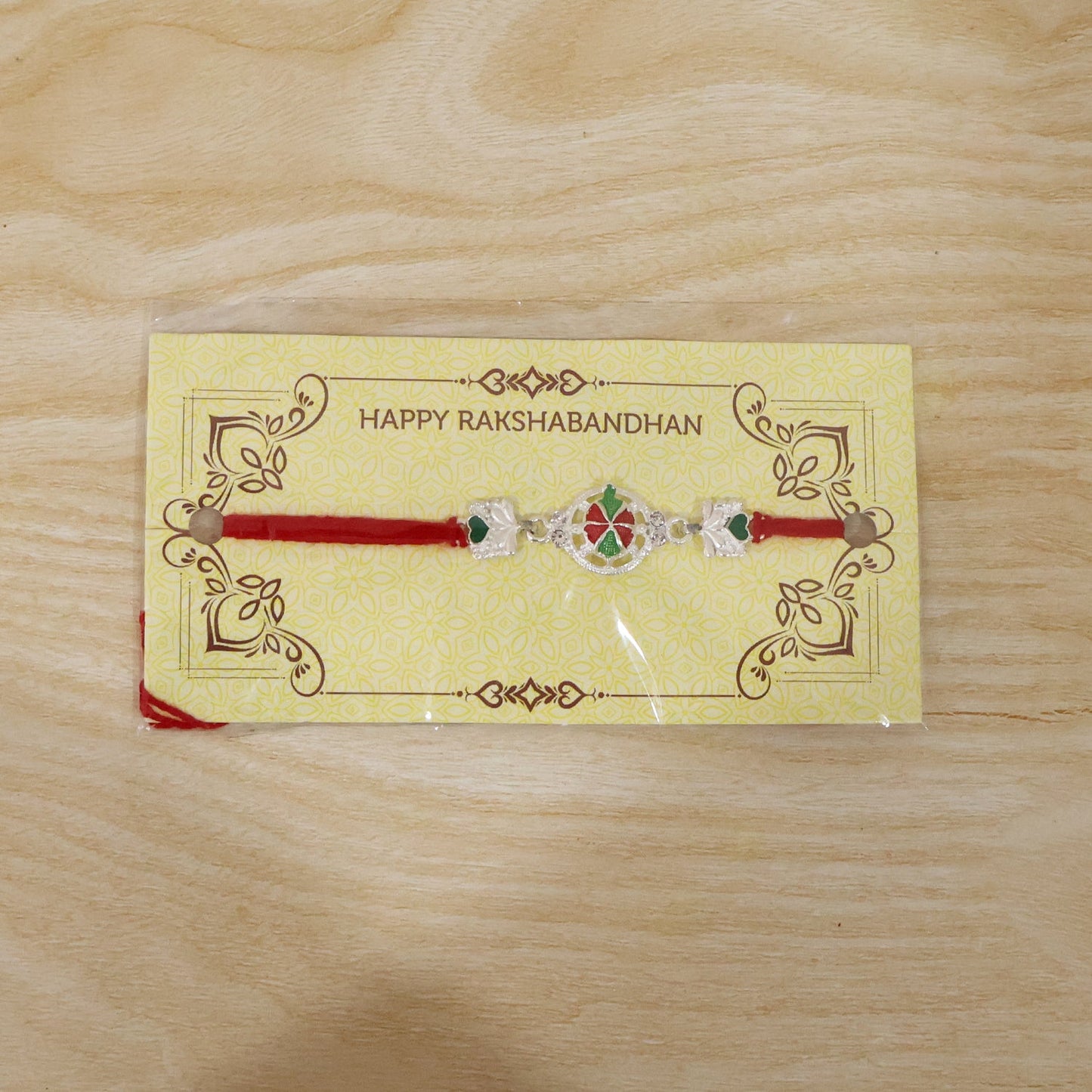 Silver Floral Design Rakhi with Red Thread (1 Pc)