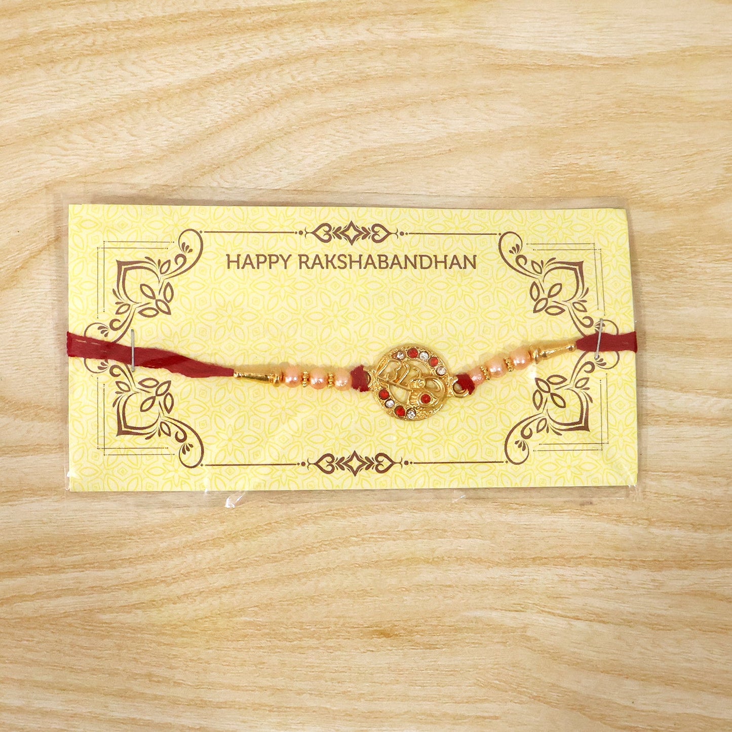 Festive setting featuring Radhe Designer Rakhi on red background