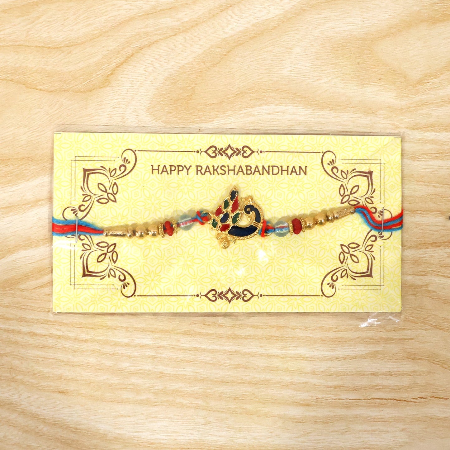 Peacock Designer Rakhi closeup of peacock design with beads