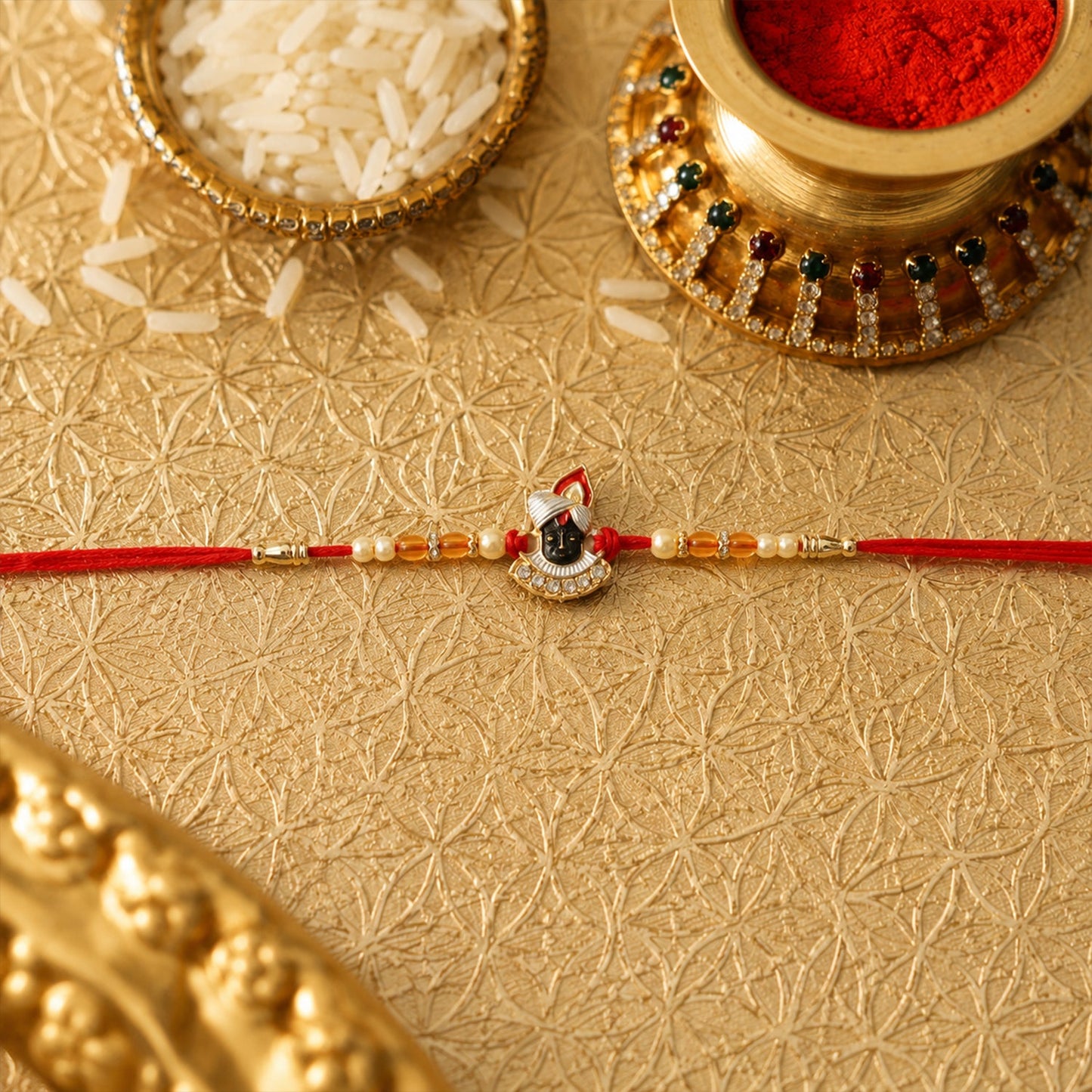 Side view of Shrinathji Designer Rakhi with pearl beads