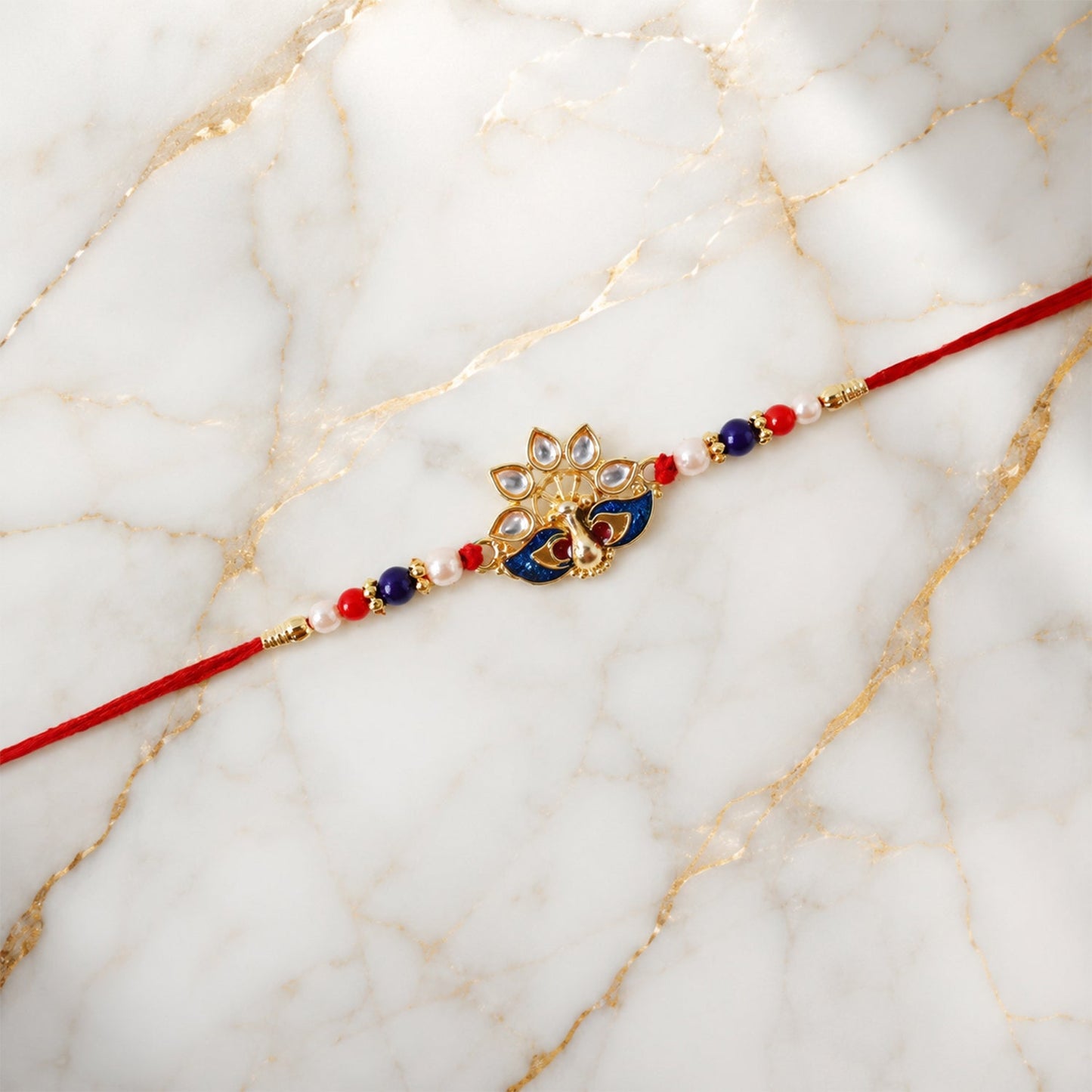 Peacock Designer Rakhi with Pearl Beads and Red Thread (1 Pc)