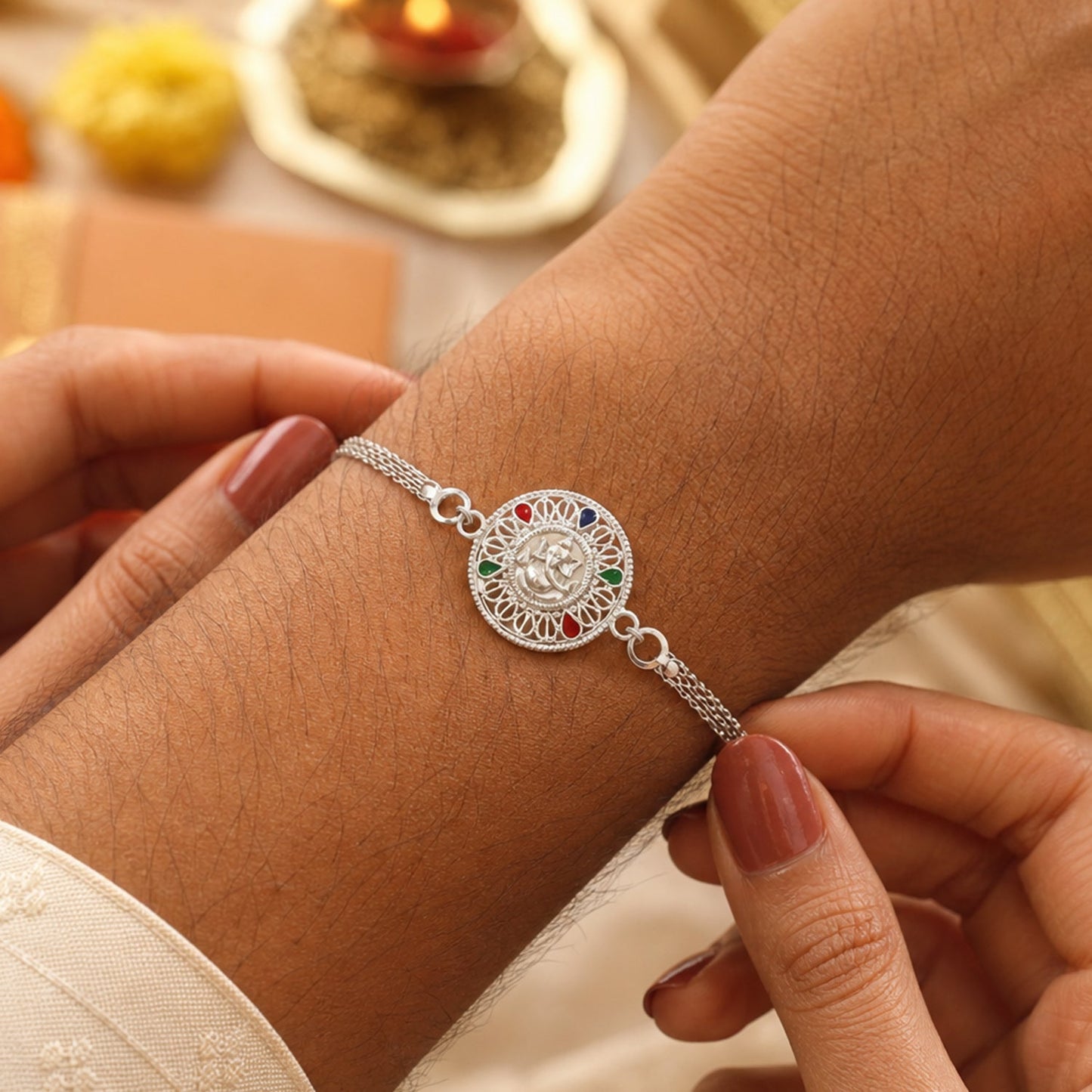 Silver Ganesh Chain Rakhi showing designer motif detail