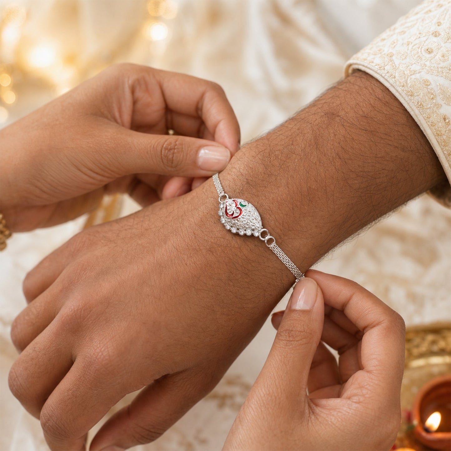 Close-up of Silver Om Chain Rakhi detailing