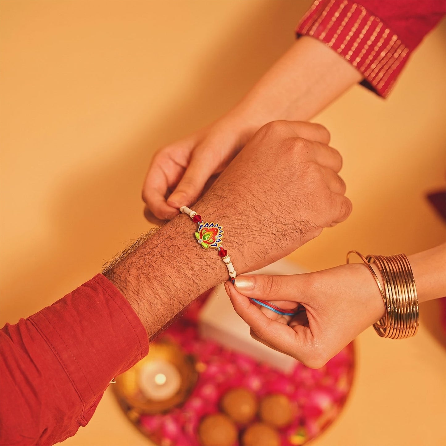 Elegant peacock feather rakhi arranged for Raksha Bandhan celebration