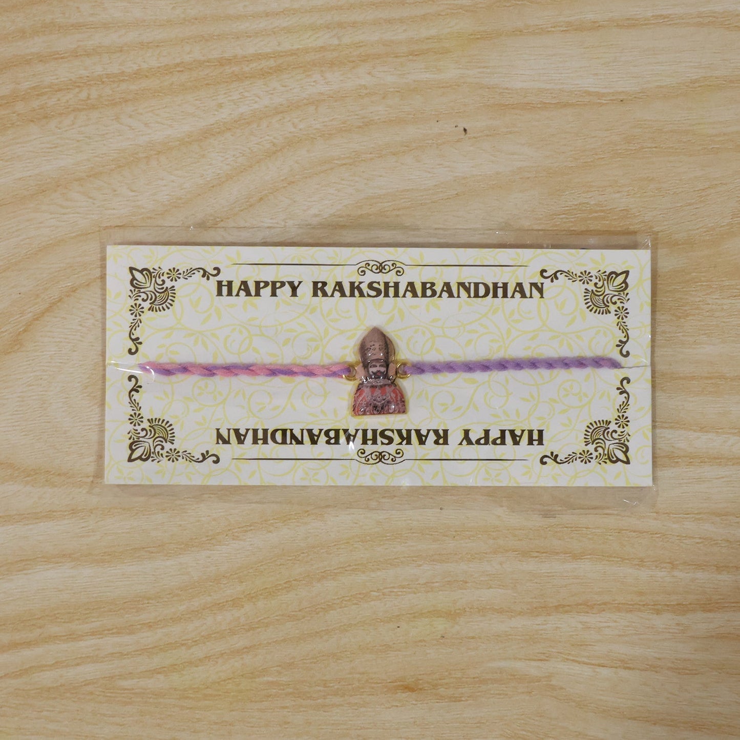 Religious Fancy Dori Rakhi displayed on white background