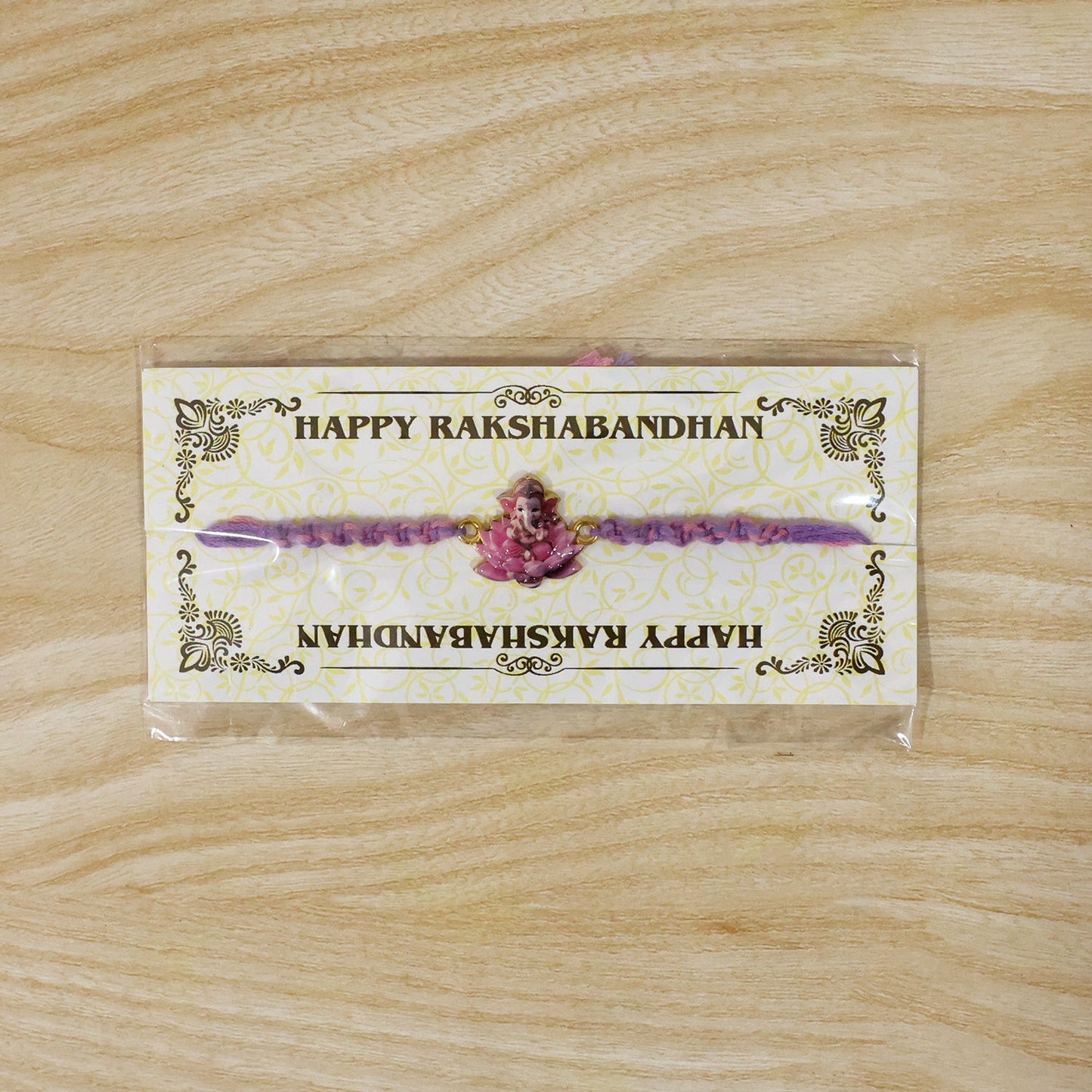 Pink Lotus Ganesh Fancy Dori Rakhi - decorative motifs close-up