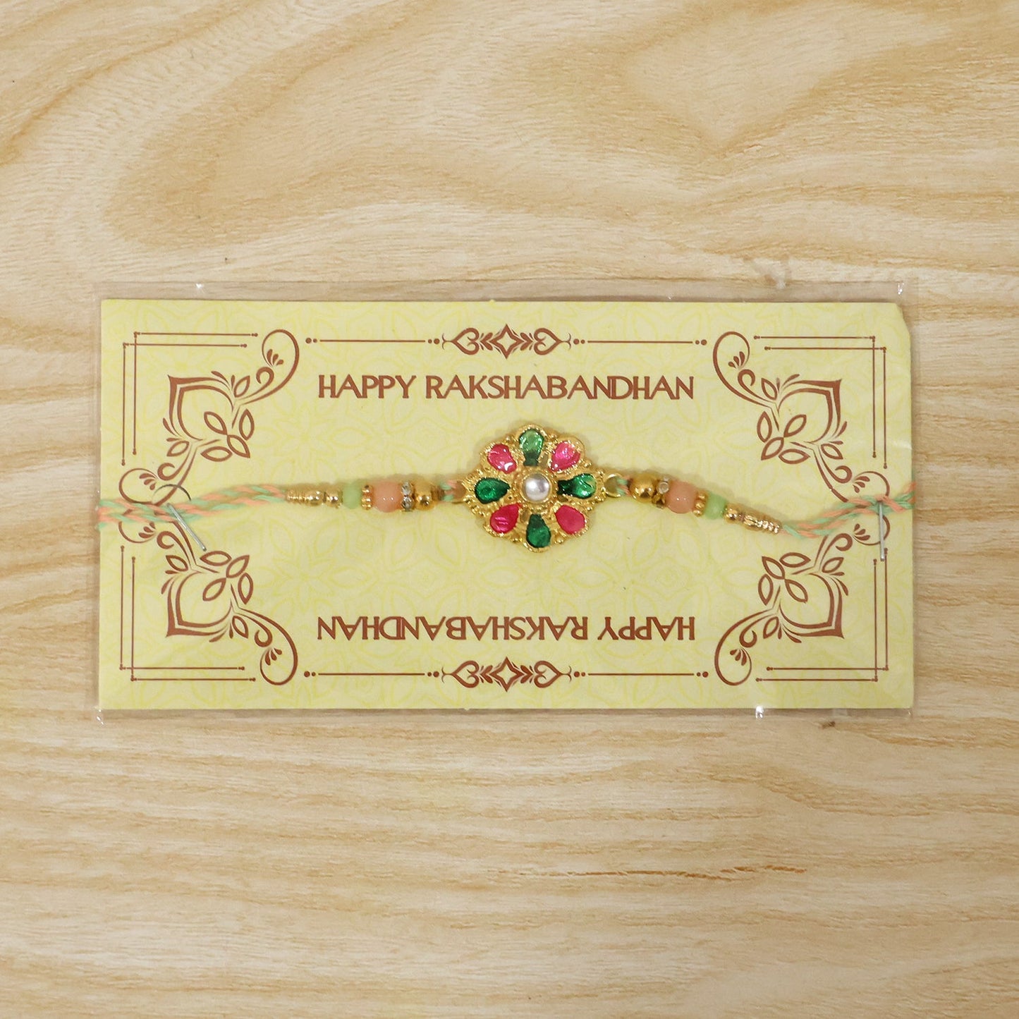 Bright and festive rakhi featuring colorful flower charm and beads