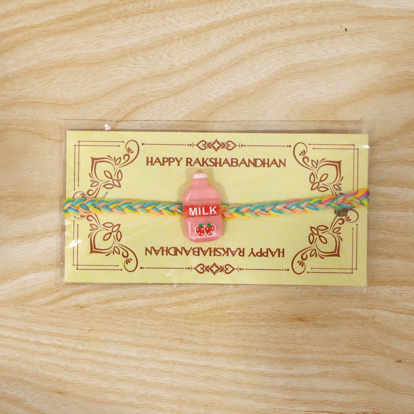 Detailed view of Milk Bottle Fancy Dori Rakhi threads