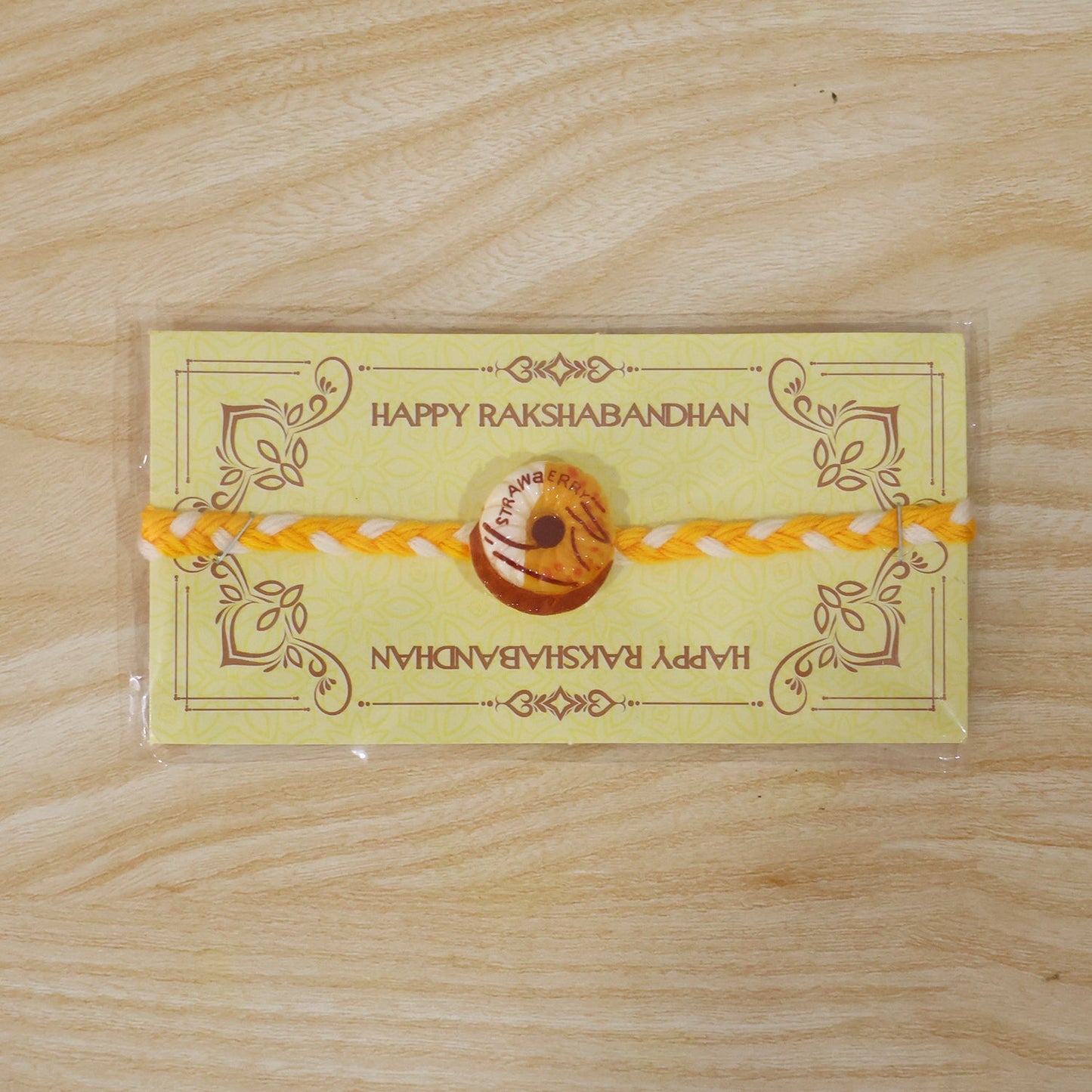 Side angle of donut charm dori rakhi