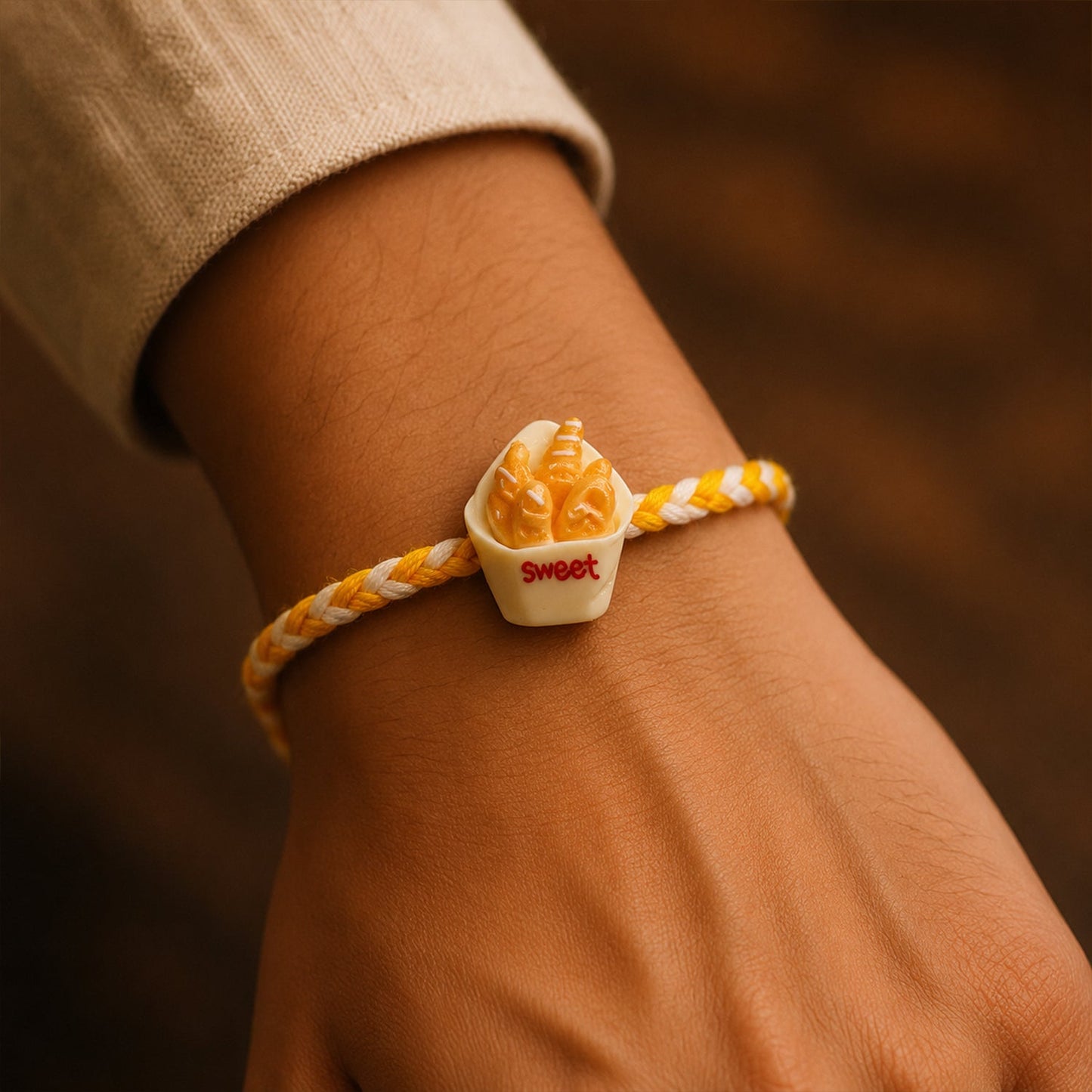 Close up of Sweet Fries Cup Fancy Dori Rakhi design