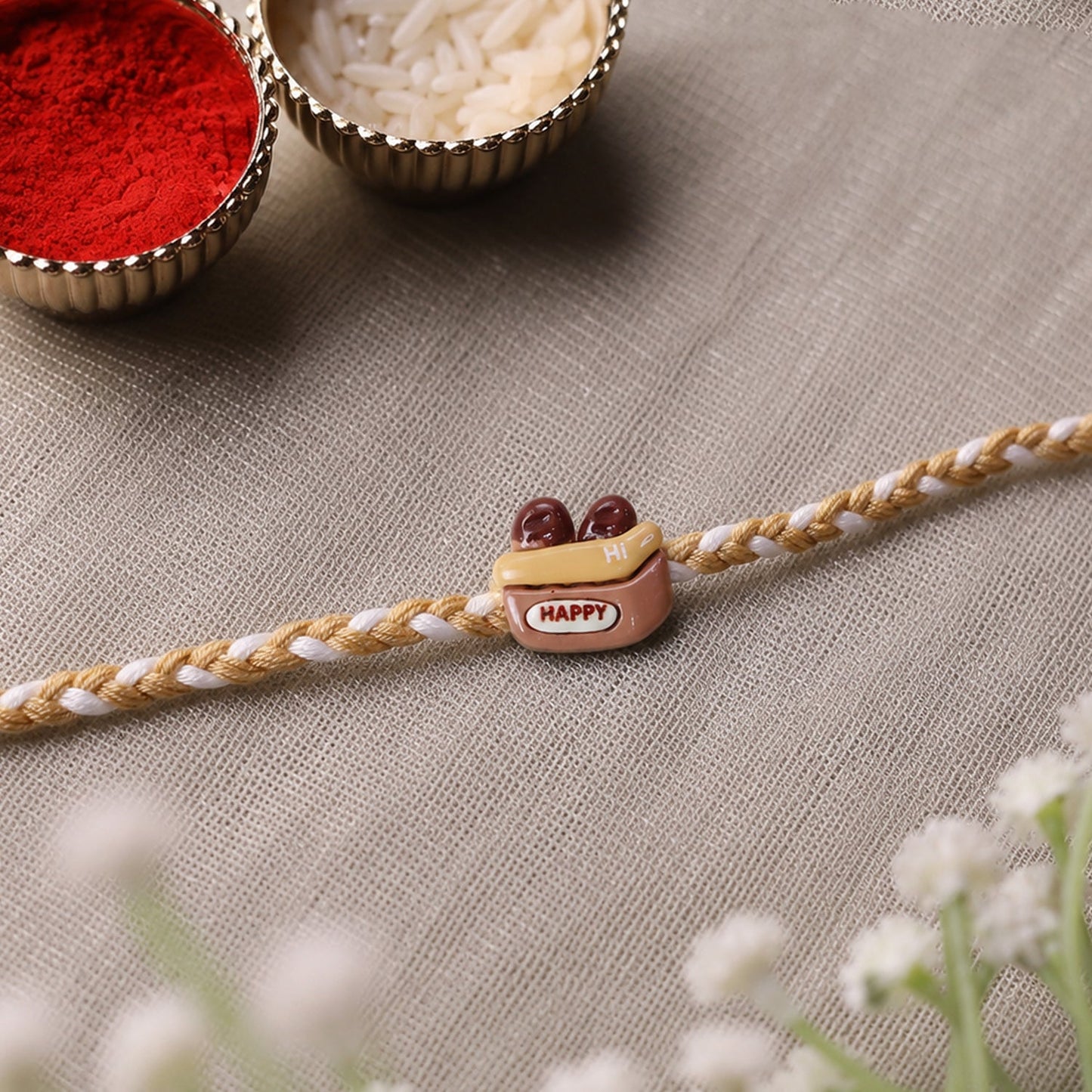 Happy Cup Charm Fancy Dori Rakhi with vibrant thread and charm