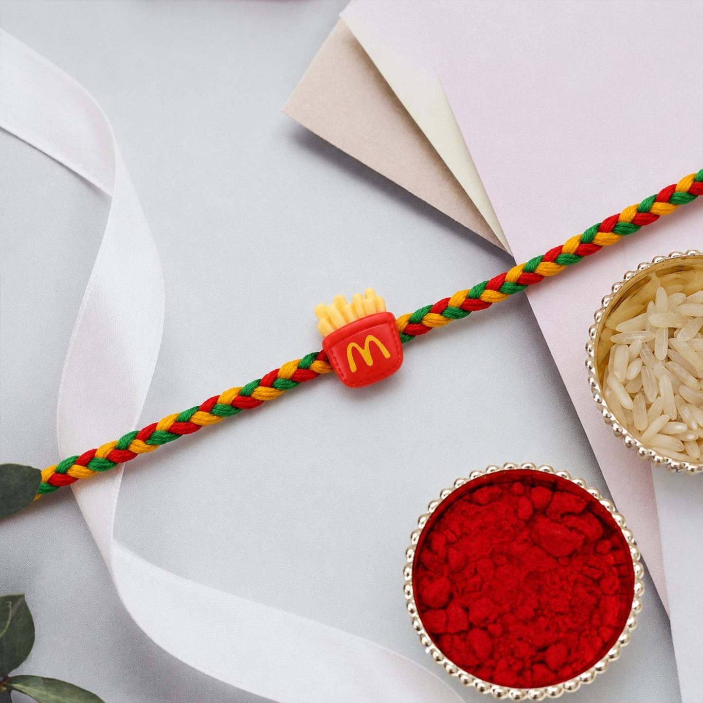 French Fries themed rakhi showing detailed charm