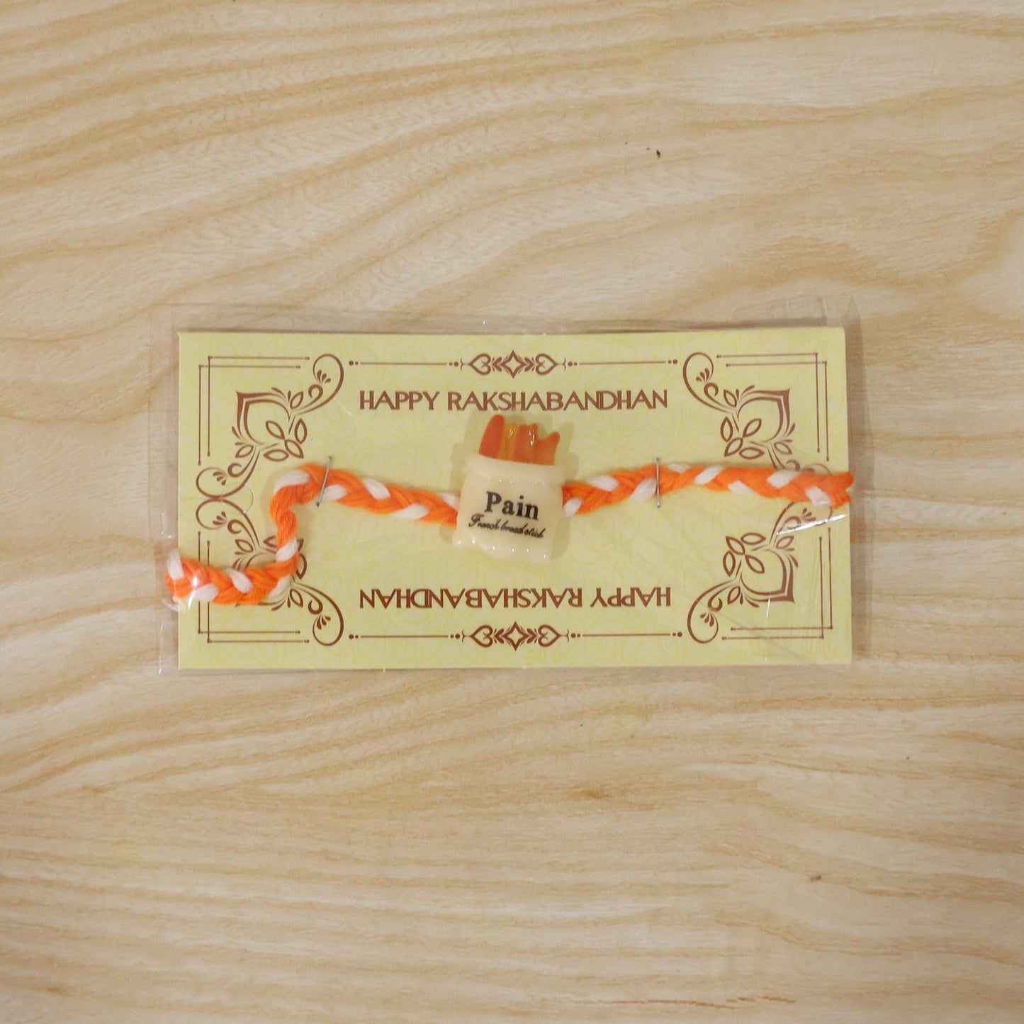 Neat finishing on food-themed fancy designer rakhi