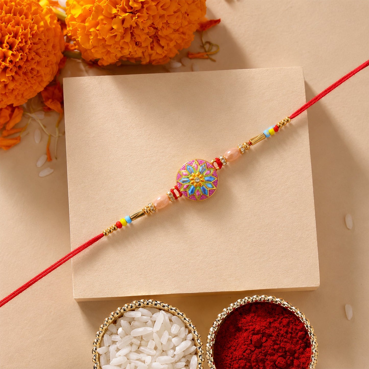 Close up of colorful meenakari charm on rakhi with beads