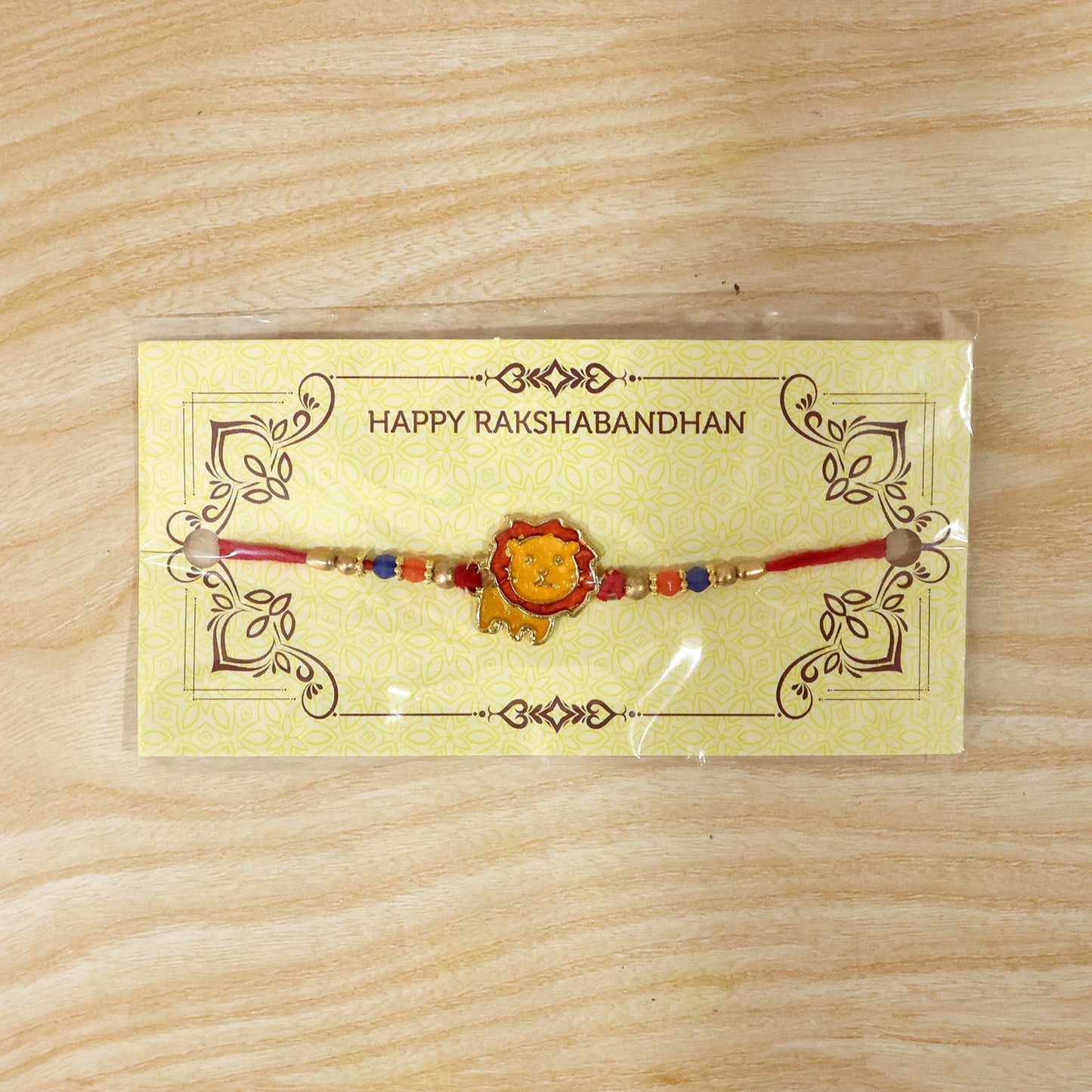 Detailed shot of lion bead rakhi design and thread
