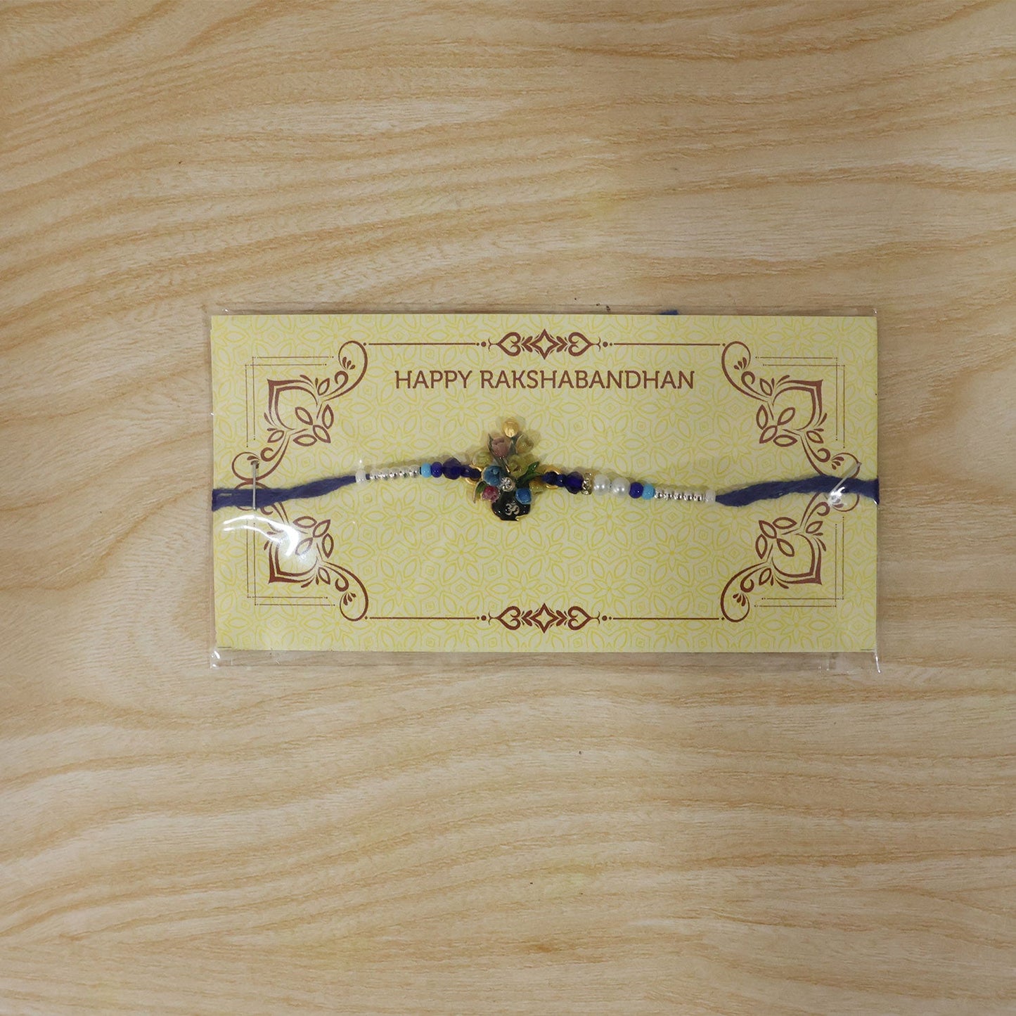 Om Flower Bouquet Meena Charm With Beads Rakhi for Brother (1 Pc)