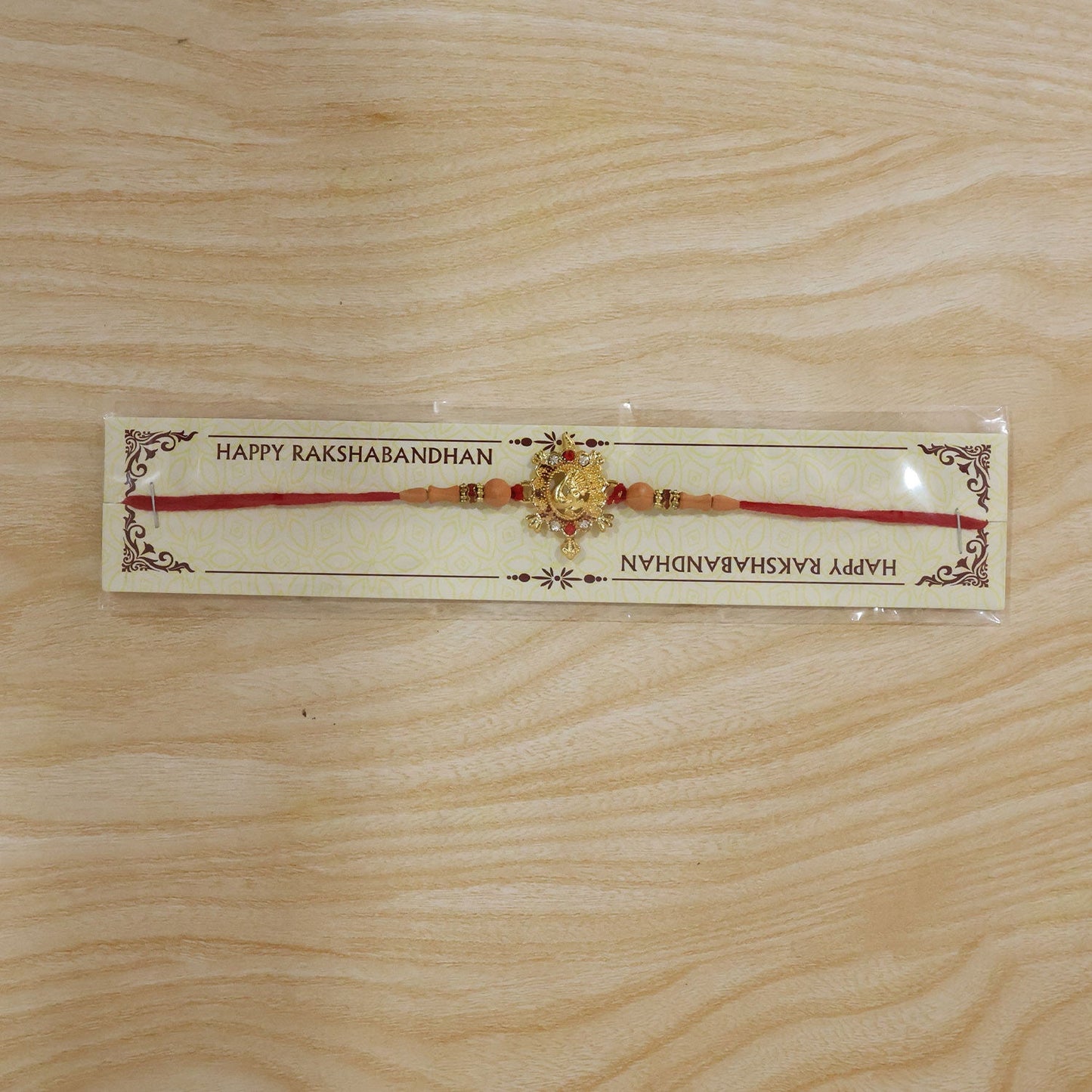 Turtle Peacock Charm Beads Rakhi on a hand