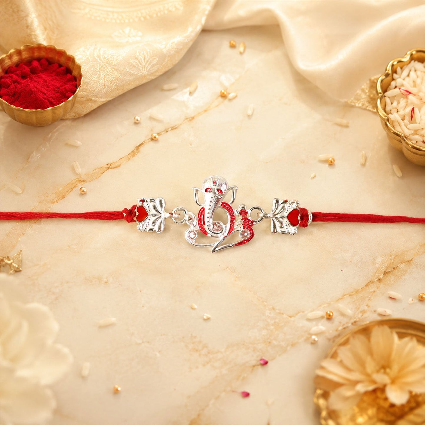 Side view of Silver Ganpati Heart Charm dori rakhi