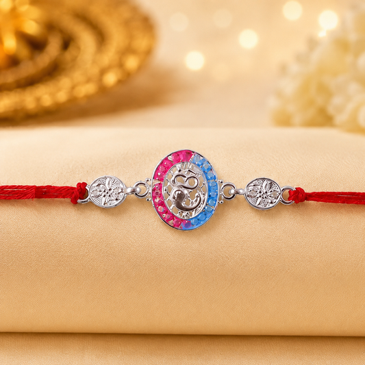 Silver charm Rakhi showing detailed design and thread