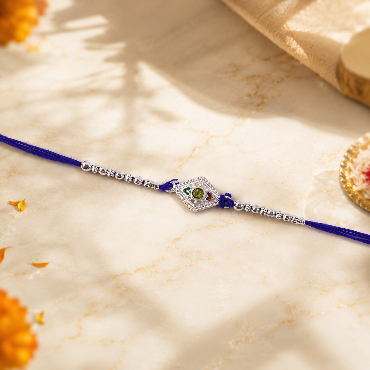 Side view of silver kite stone charm Rakhi with beads