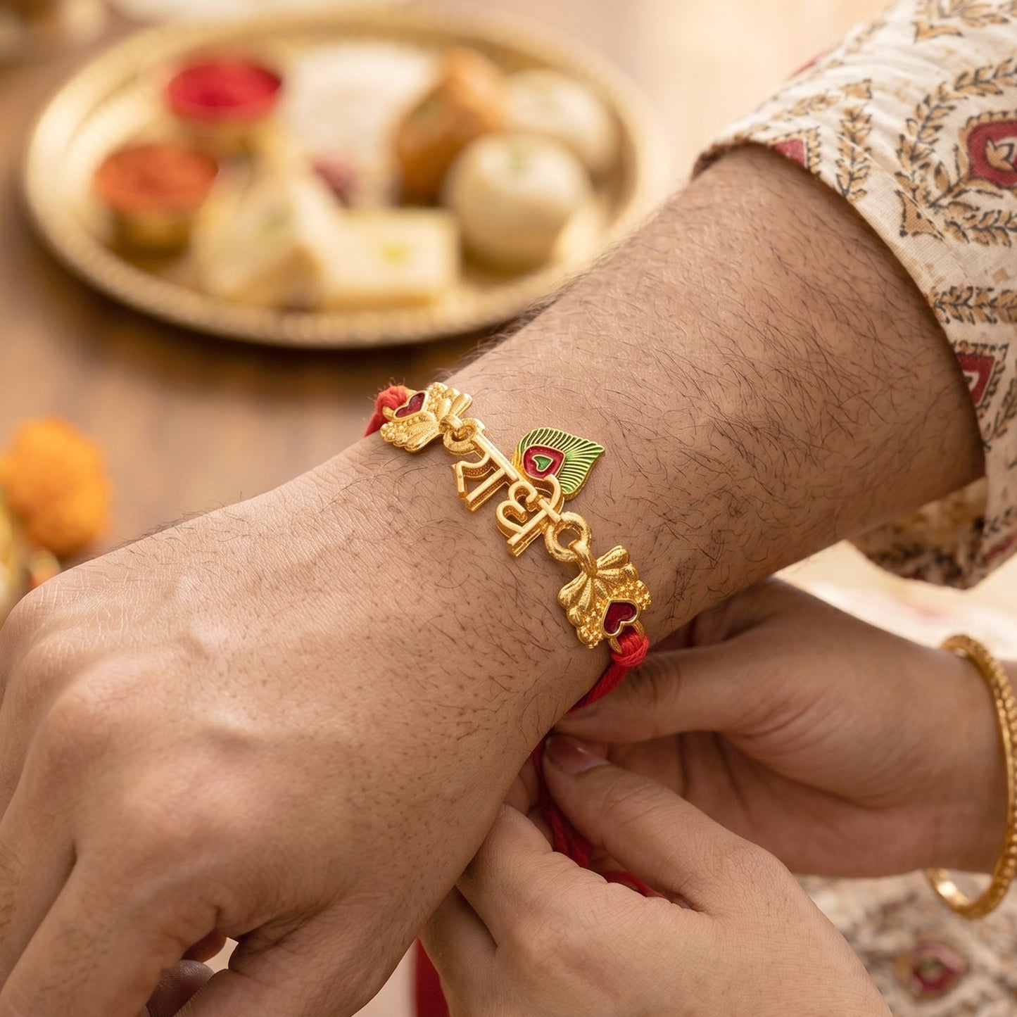 Golden 'Radhe' Rakhi with Peacock Feather