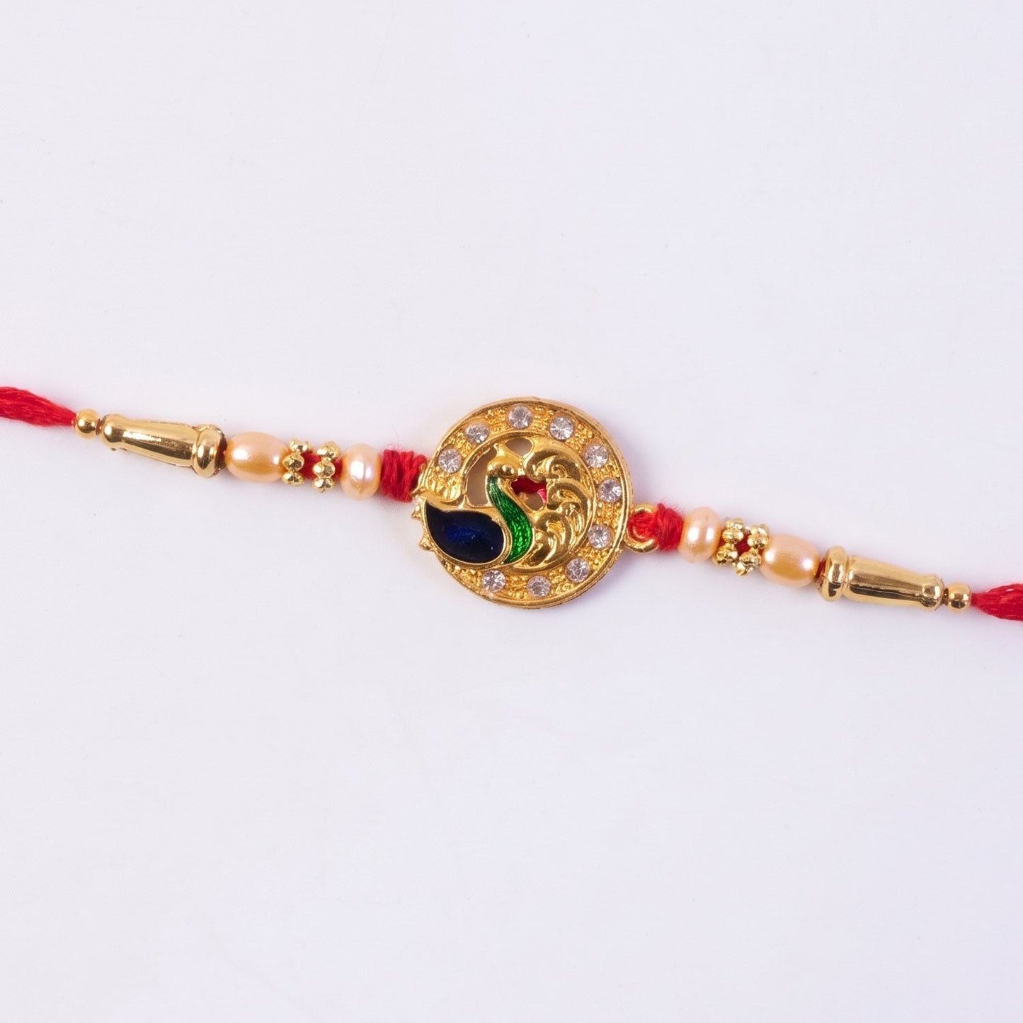Golden Peacock Rakhi with CZ Stones
