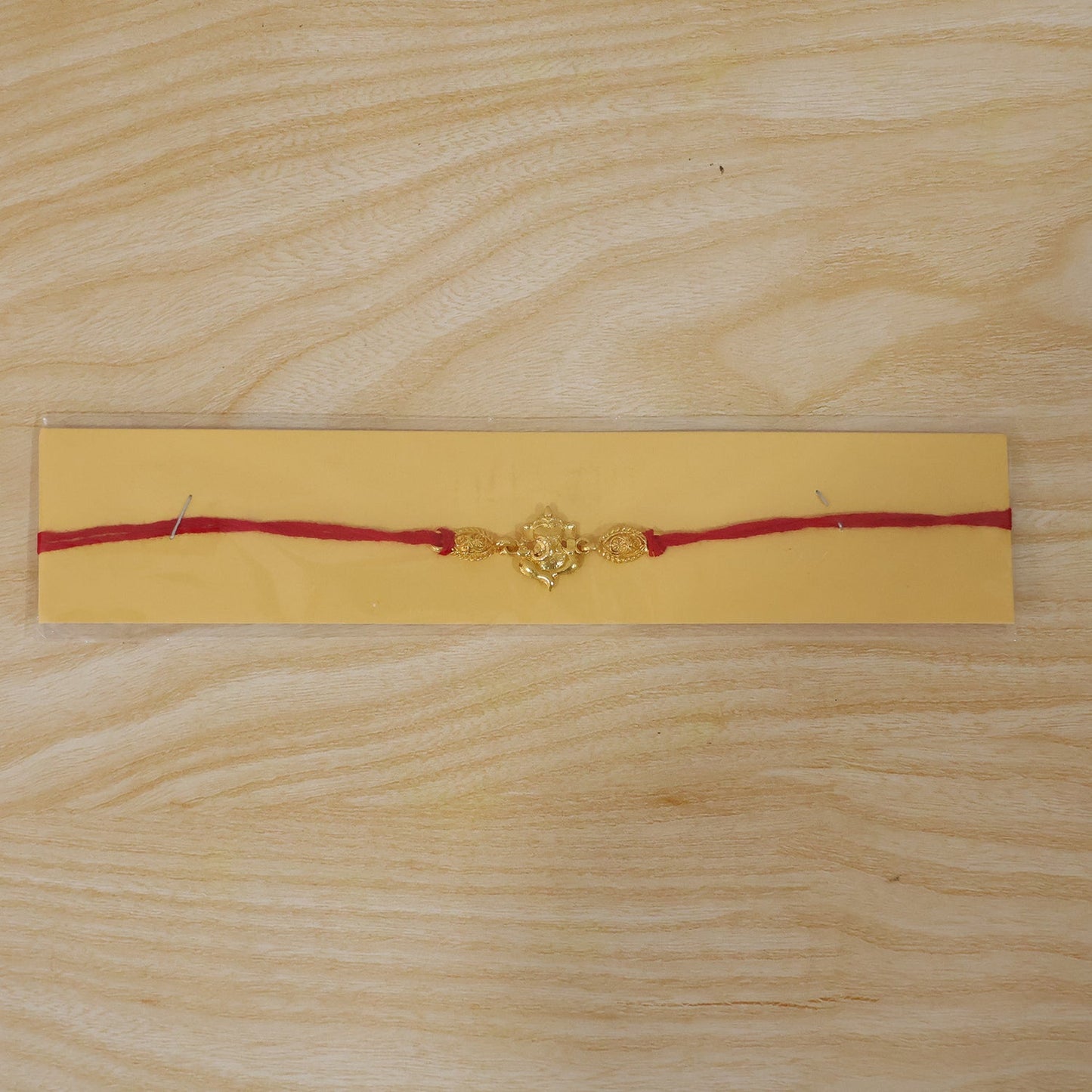 Twin Lord Ganesha Golden Rakhi