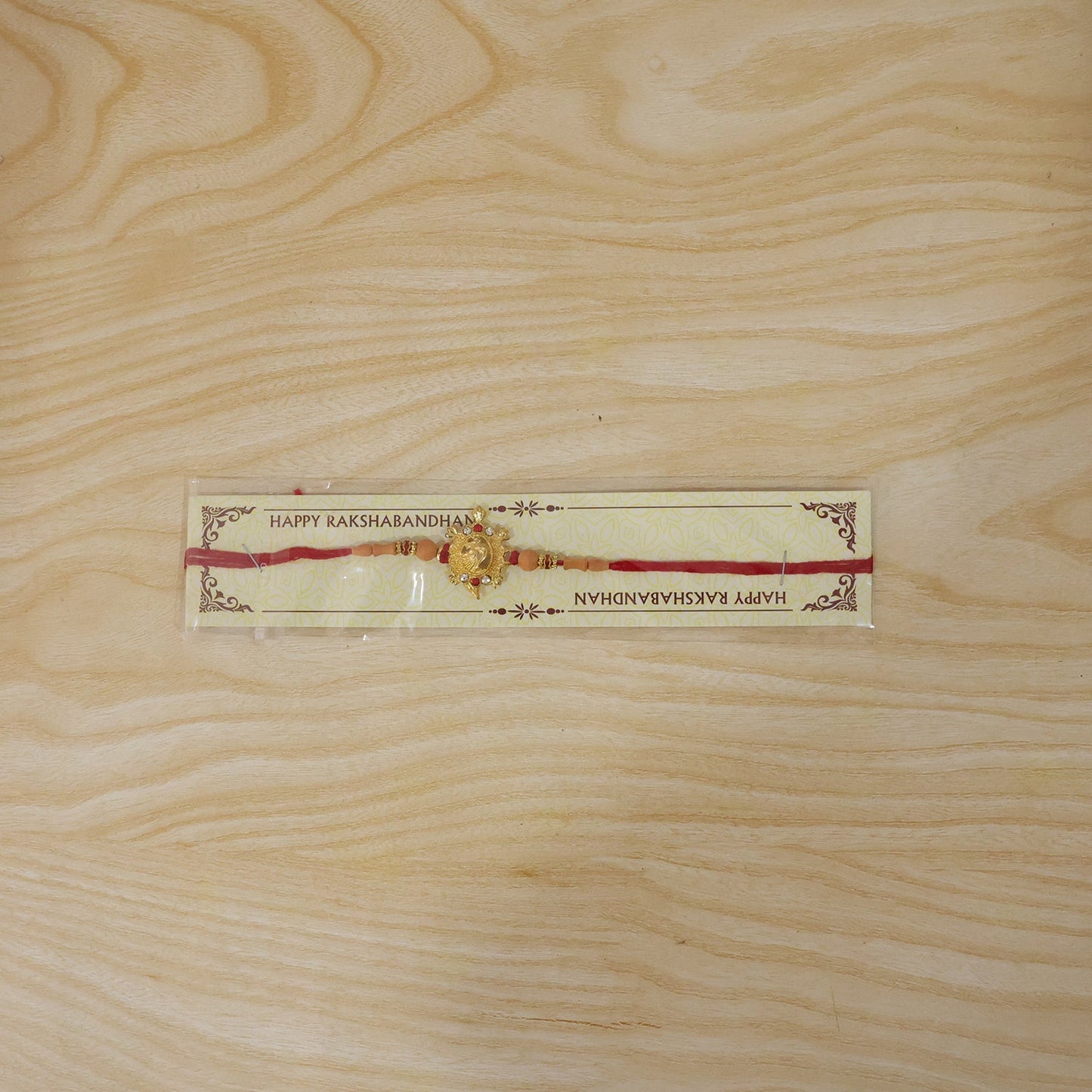 Traditional Golden Om Rakhi with Beads for Brother - Rakshabandhan Gift