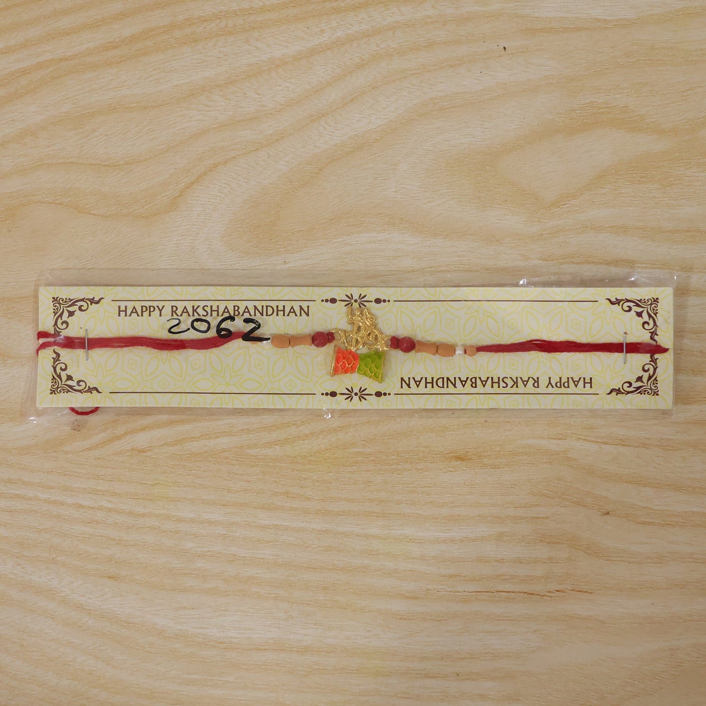 Fancy Golden Om Rakhi with Colourful Kite Charm for Brother - Kids Rakhi