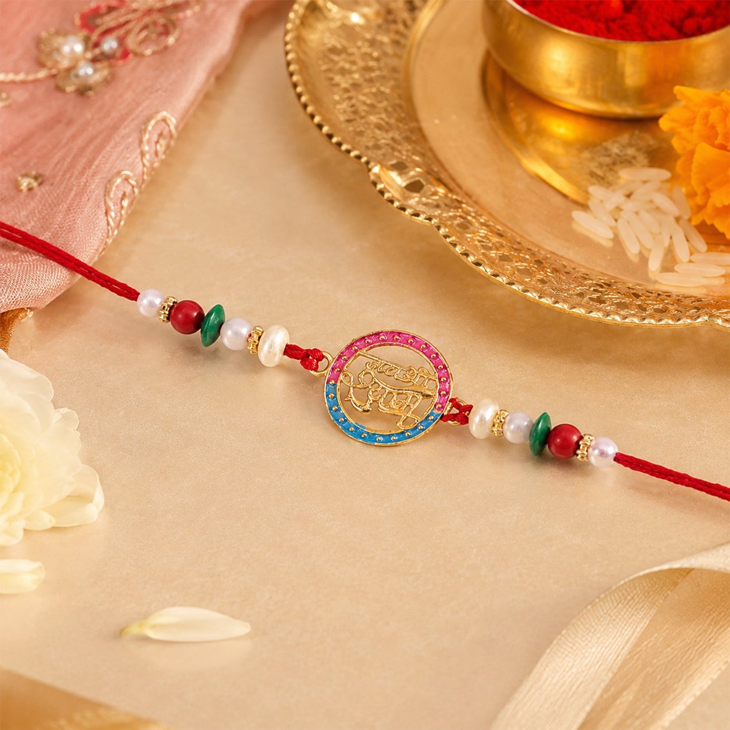 Golden Jay Shree Shyam Rakhi with pearls on a decorative background