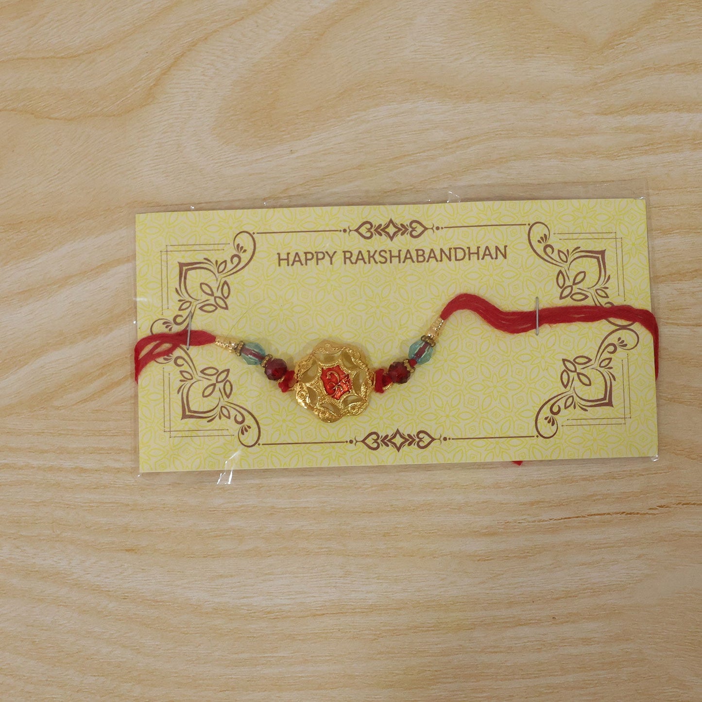 Golden Floral Rakhi with Red Stone & Crystal Beads for Brother