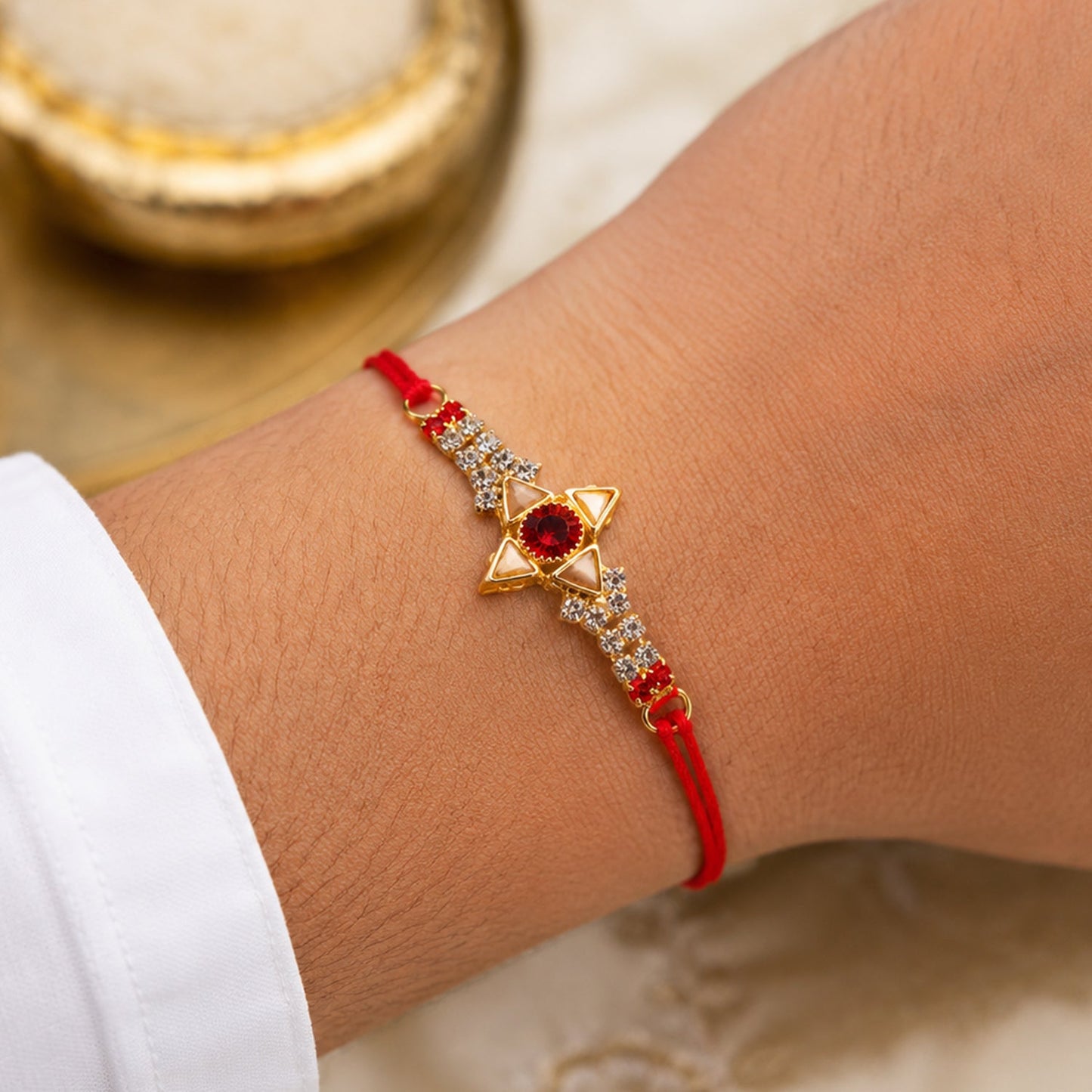 Sparkling Gold Marquise Rakhi with Red Stone & AD for Brother