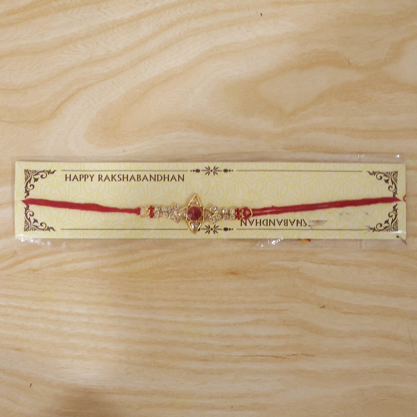 Sparkling Gold Marquise Rakhi with Red Stone & AD for Brother