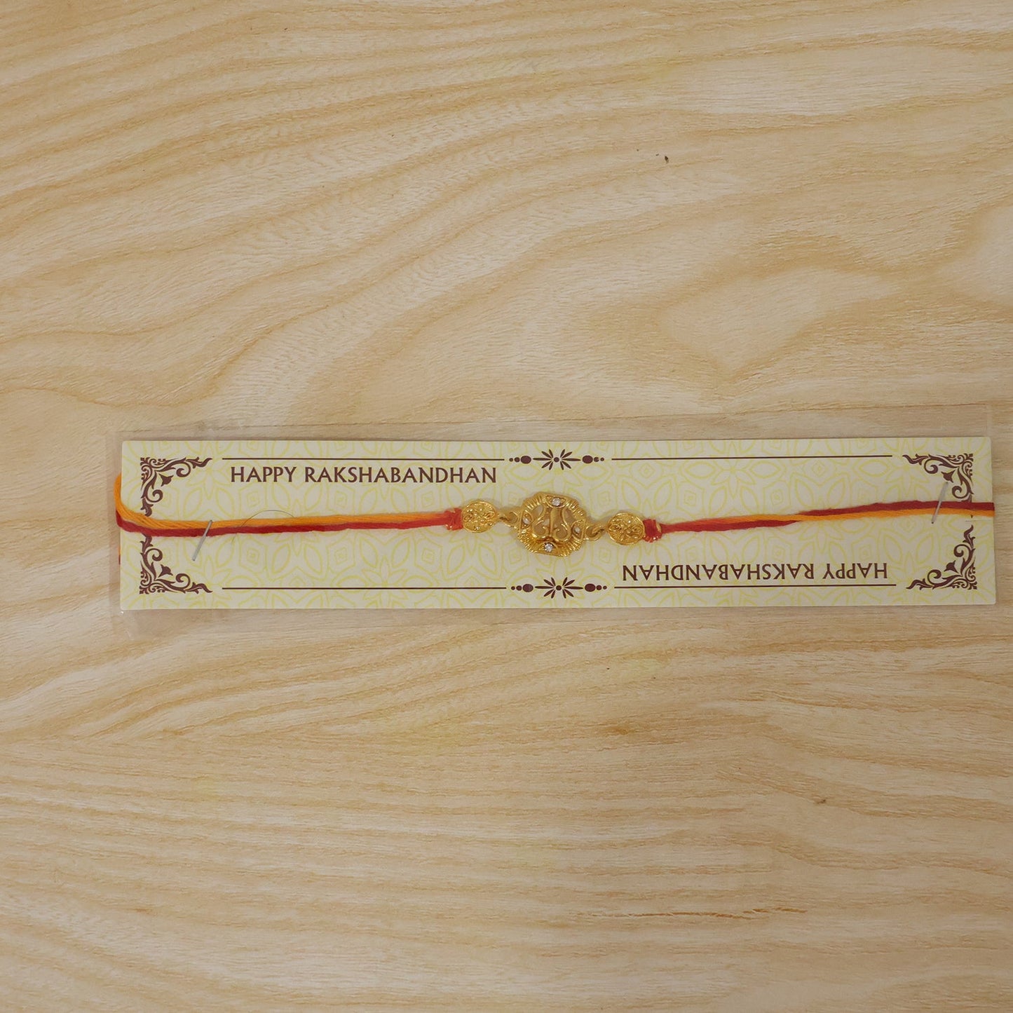 Traditional Golden Rakhi with Leaf Design for Brother
