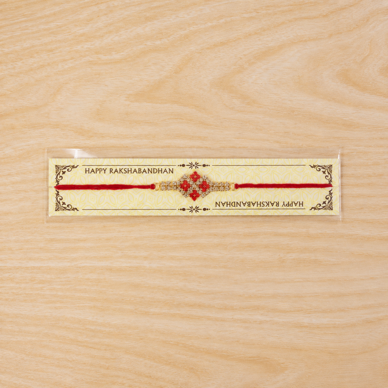 Sparkling AD Stone Band Rakhi with Red Stones for Brother