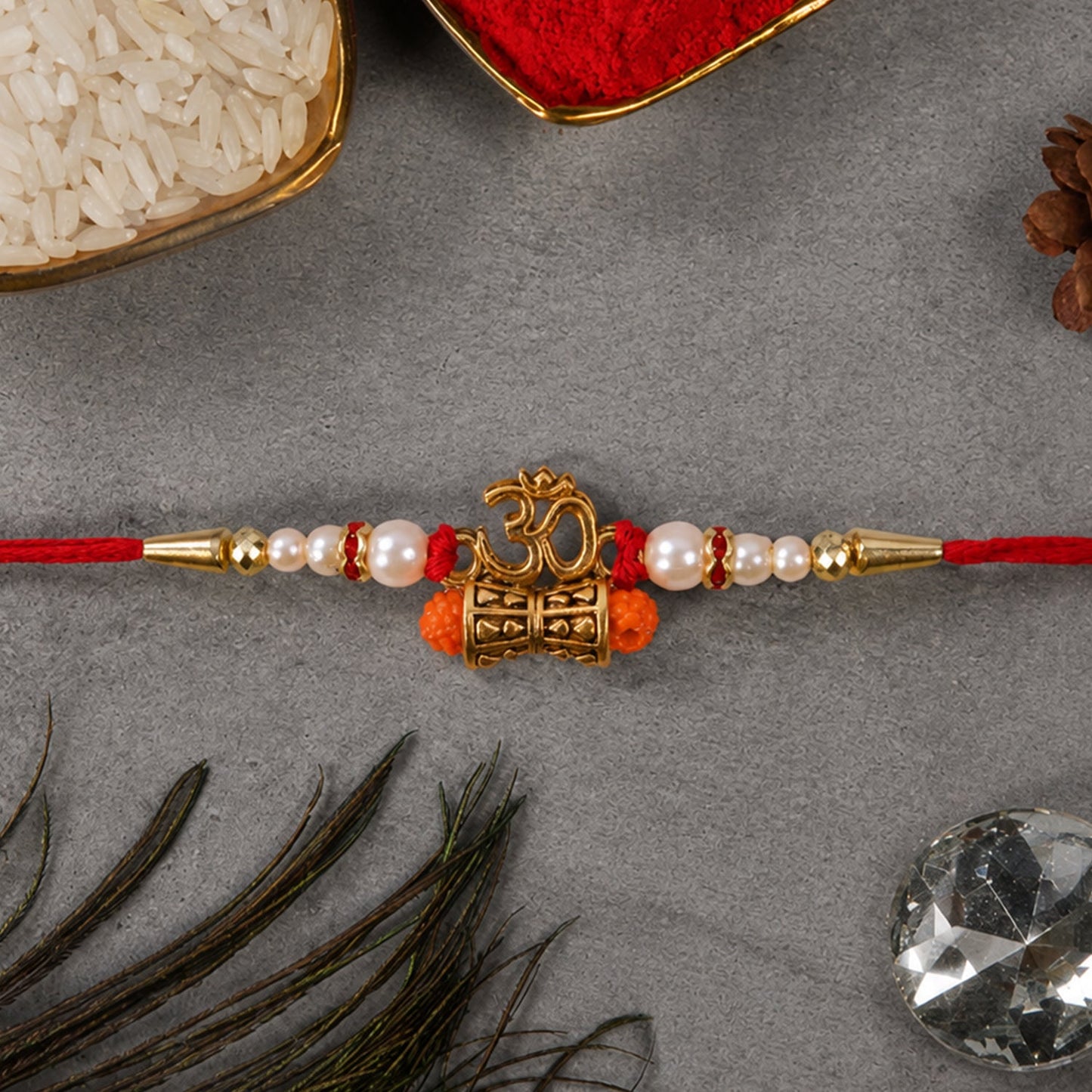 Traditional Golden Om Rakhi with Rudraksha & Pearls for Brother