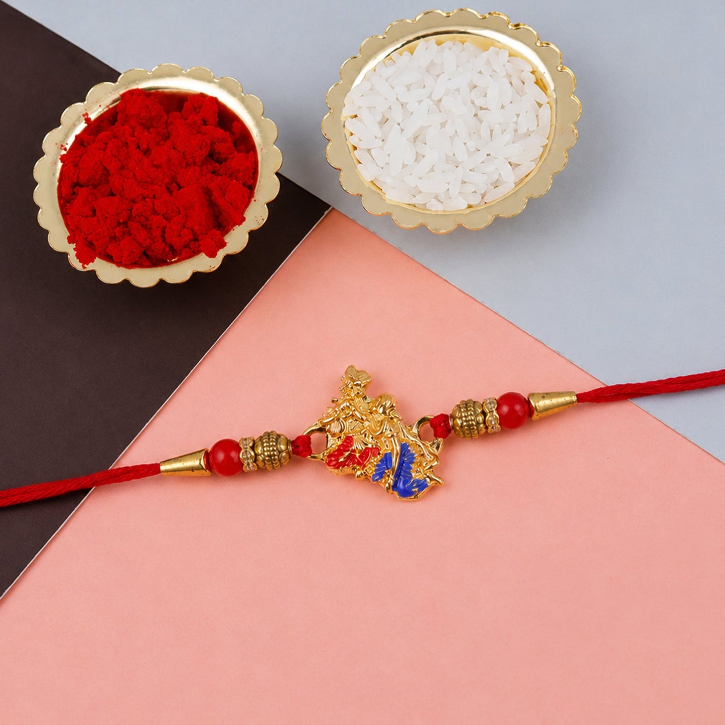 Golden Peacock (Mor) Rakhi with Blue Enamel & Red Beads