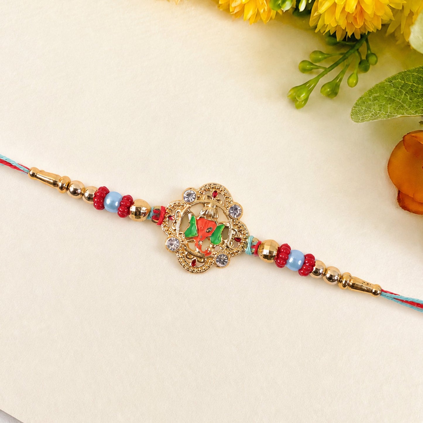 Colourful Floral Kundan Rakhi with Green Peacock Accent